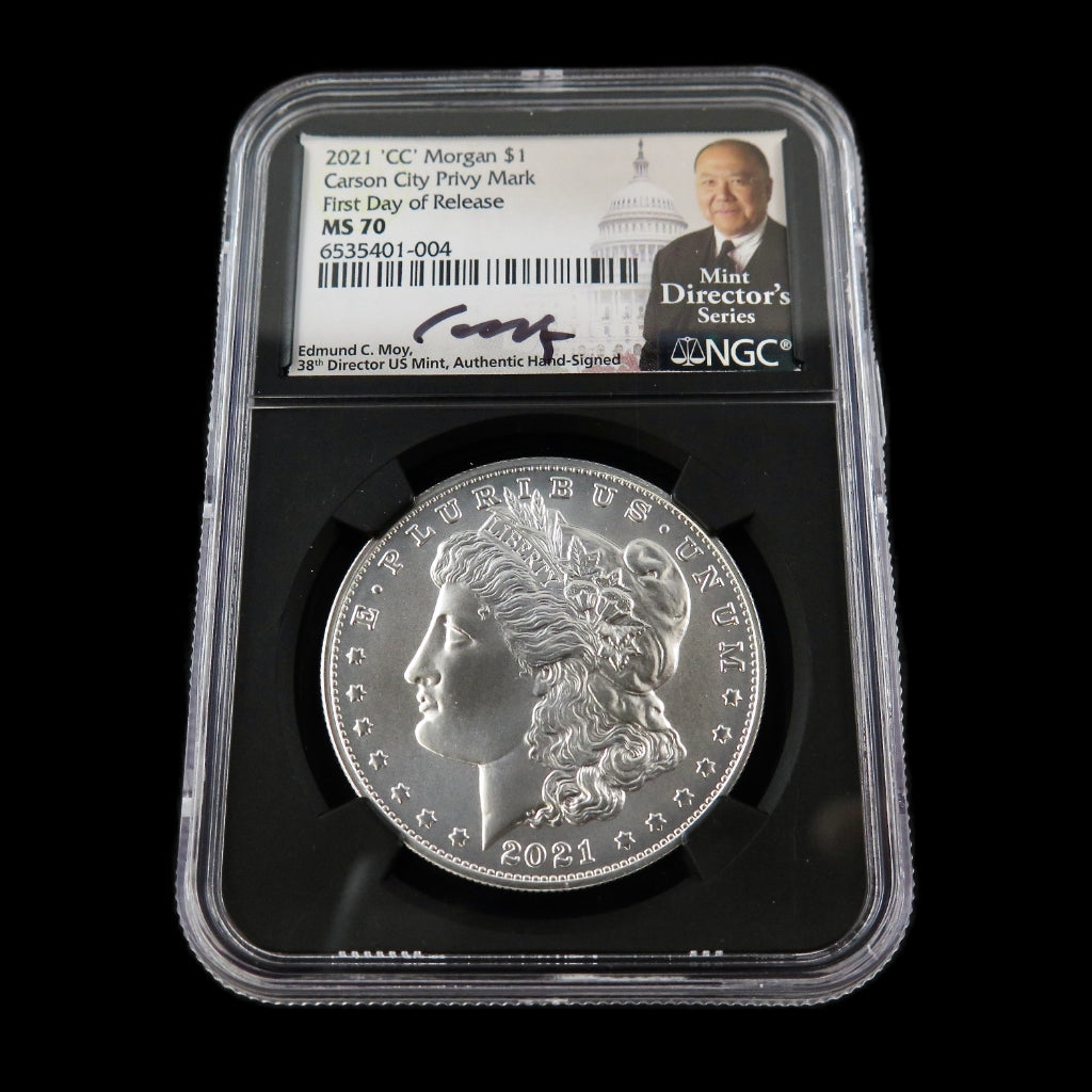 2021 Morgan Silver Dollar commemorative coin in NGC MS70 grade, signed by Edmund Moy, showcasing intricate coin details.