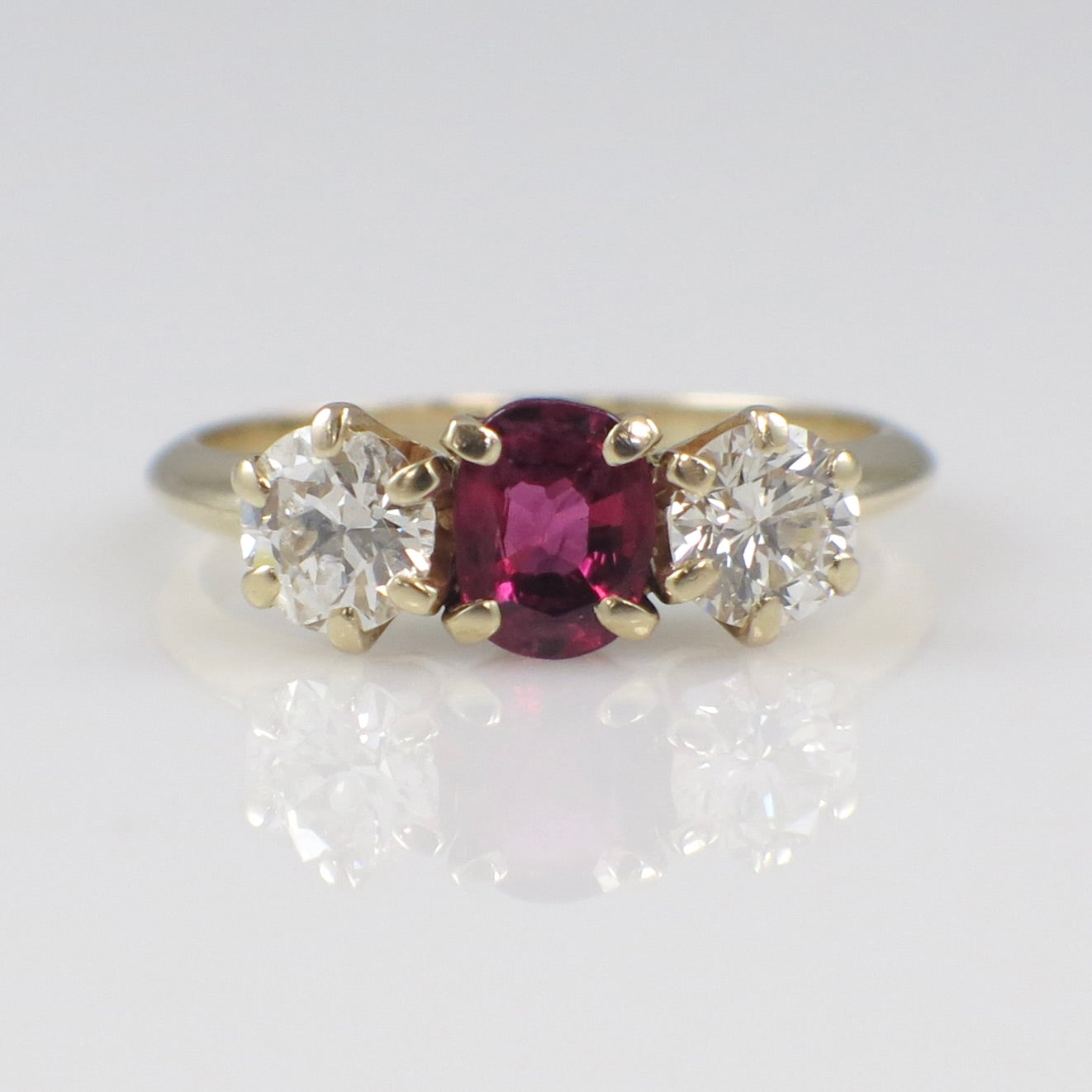 14K yellow gold ruby and diamond three-stone ring with vintage style, 1.00 carat total weight, size 5.75 by Black Market LLC.