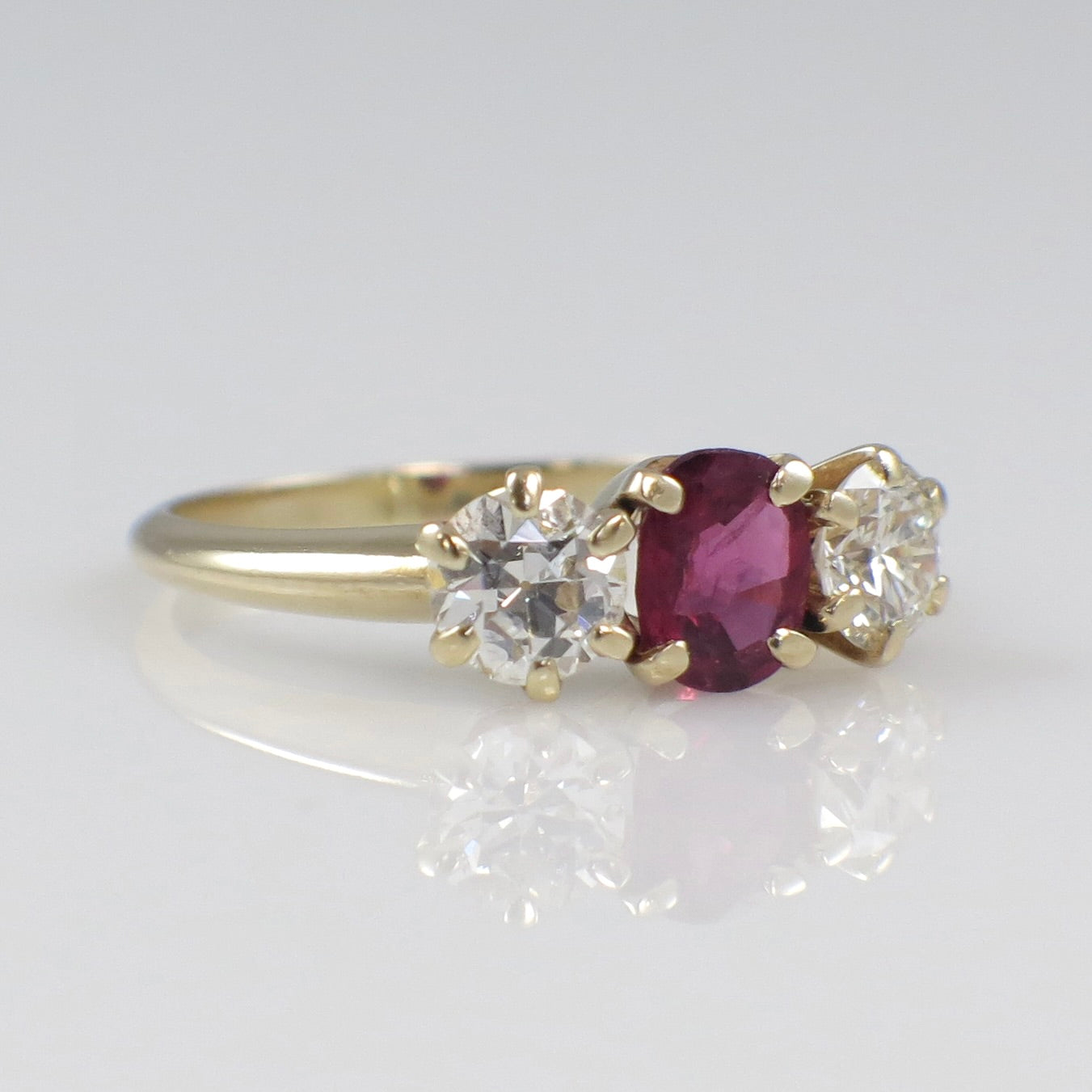 14K yellow gold ruby and diamond three-stone ring with vintage style, 1.00 carat total weight, size 5.75, by Black Market LLC.