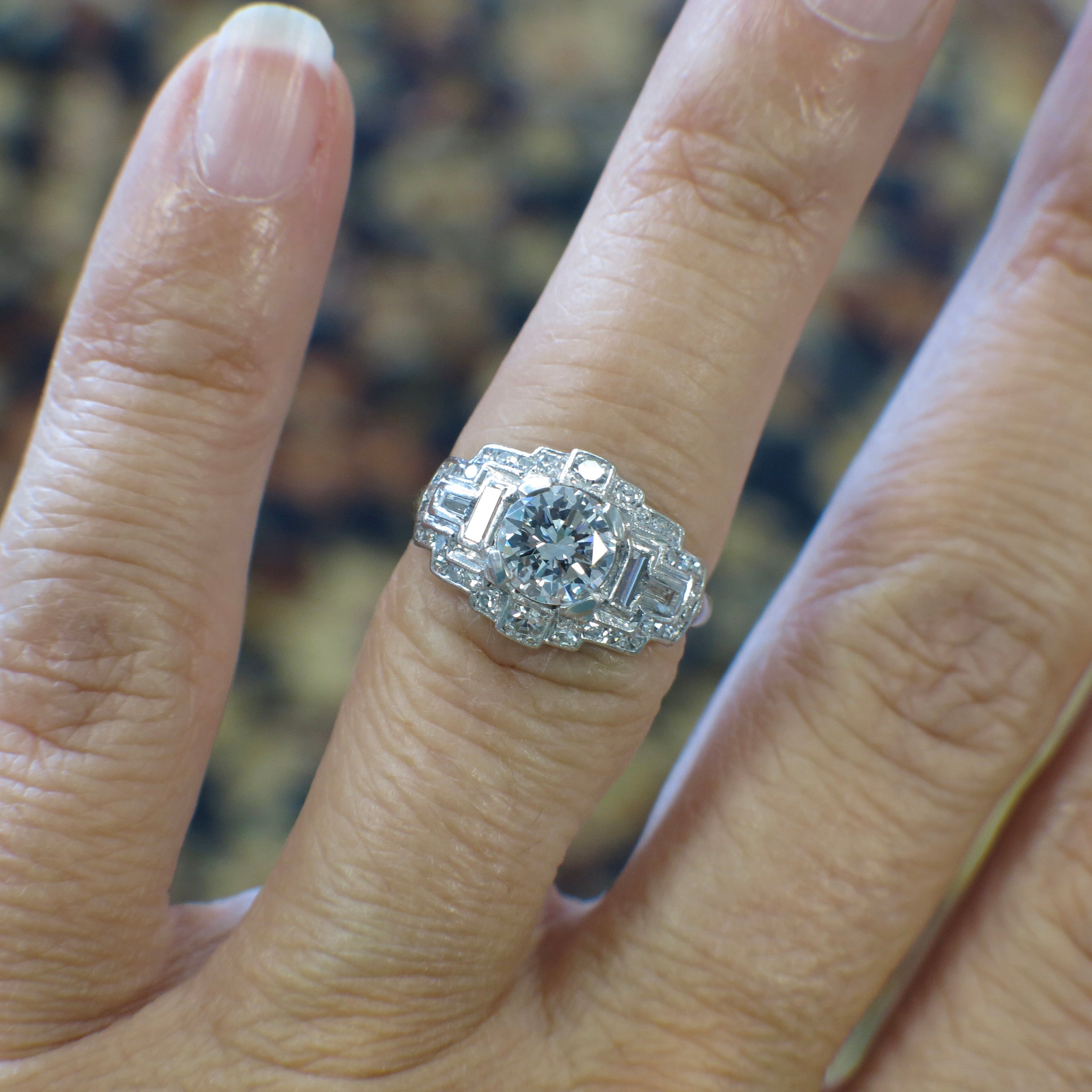 Lillian James Bridal Art Deco platinum diamond ring with 0.88ct E SI1 GIA vintage engagement design, featuring intricate detailing.