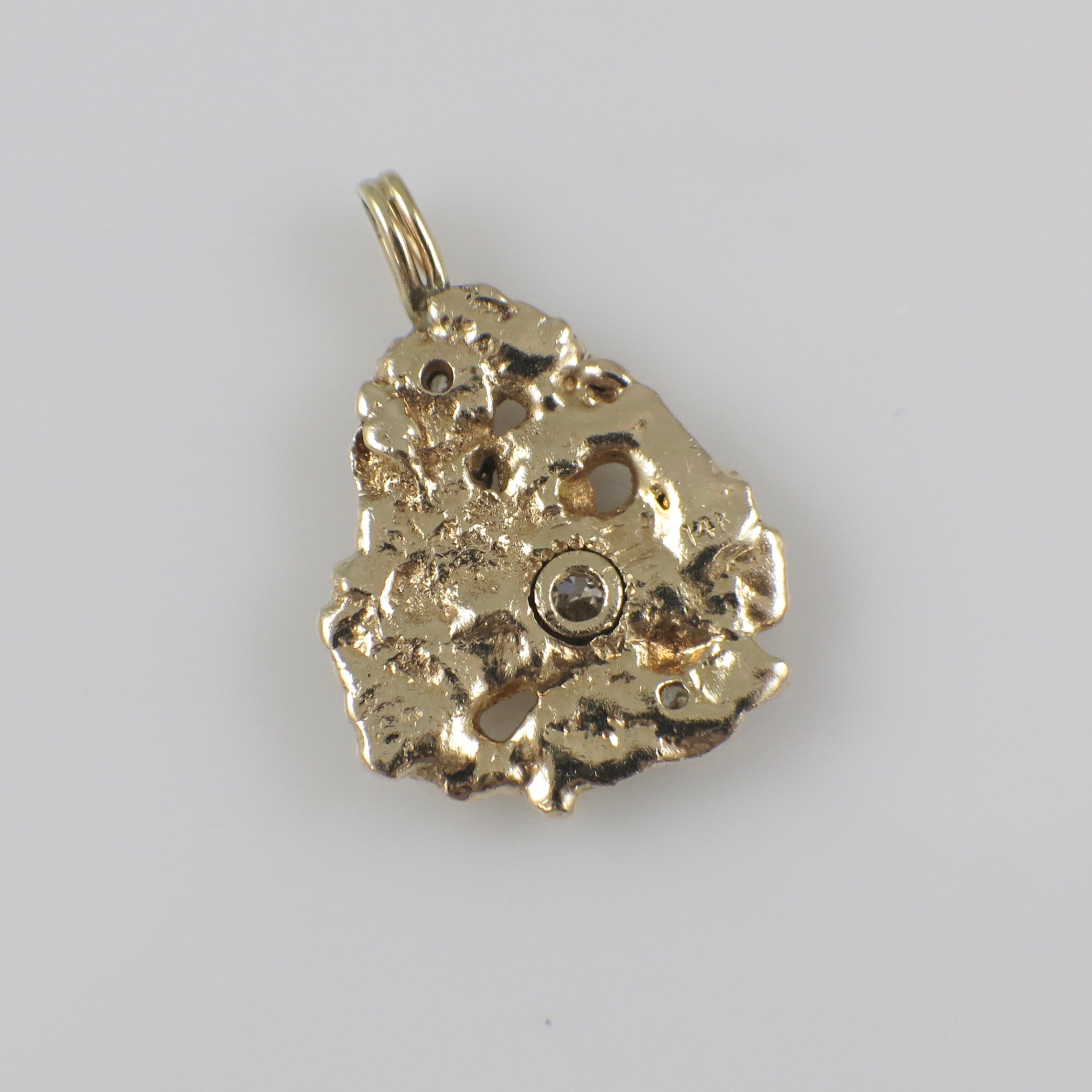14K yellow gold nugget diamond pendant with 0.53 carats of natural diamonds, featuring a sleek, polished design.