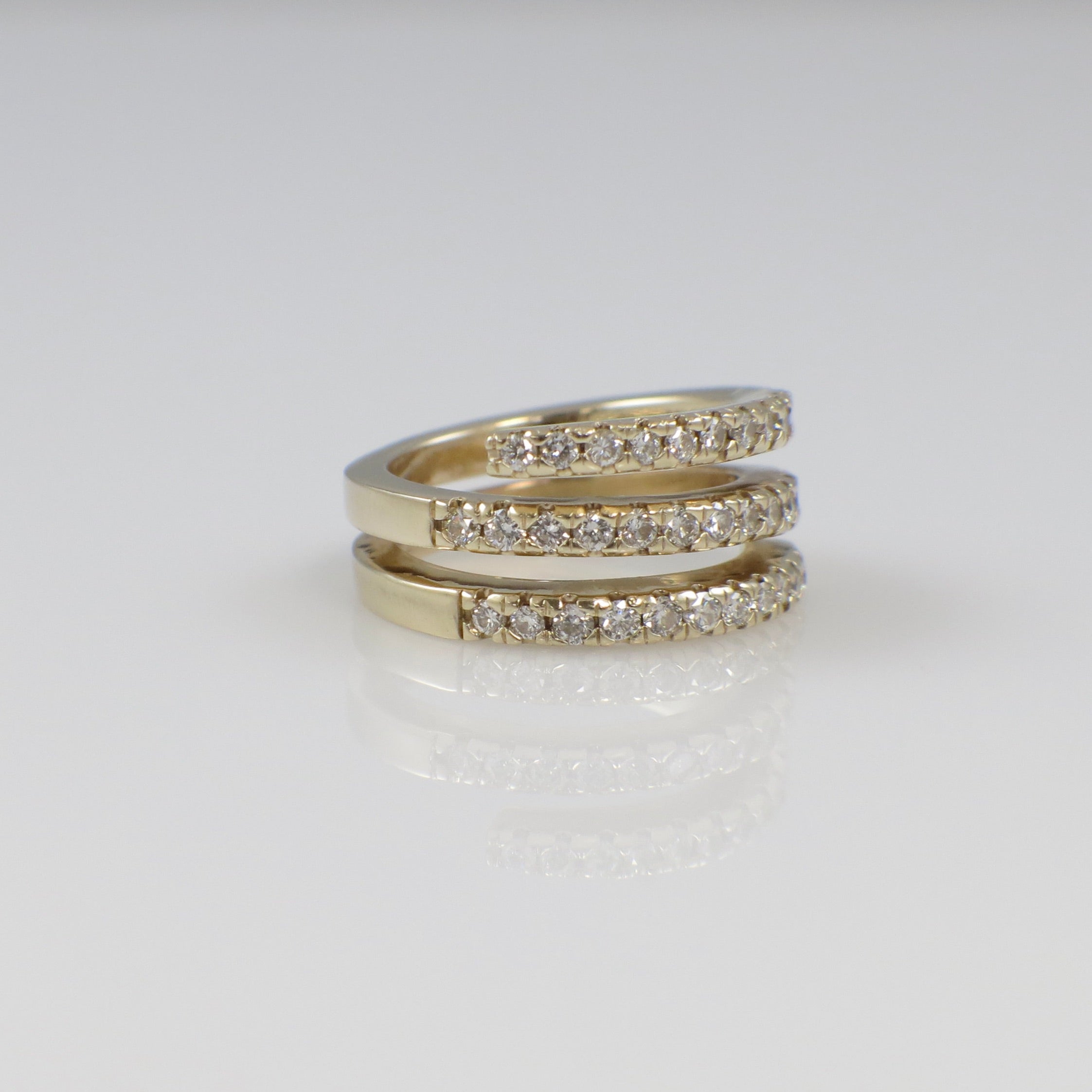 14K yellow gold CZ wrap ring with triple bands and cubic zirconia accents, size 4, by Black Market LLC.