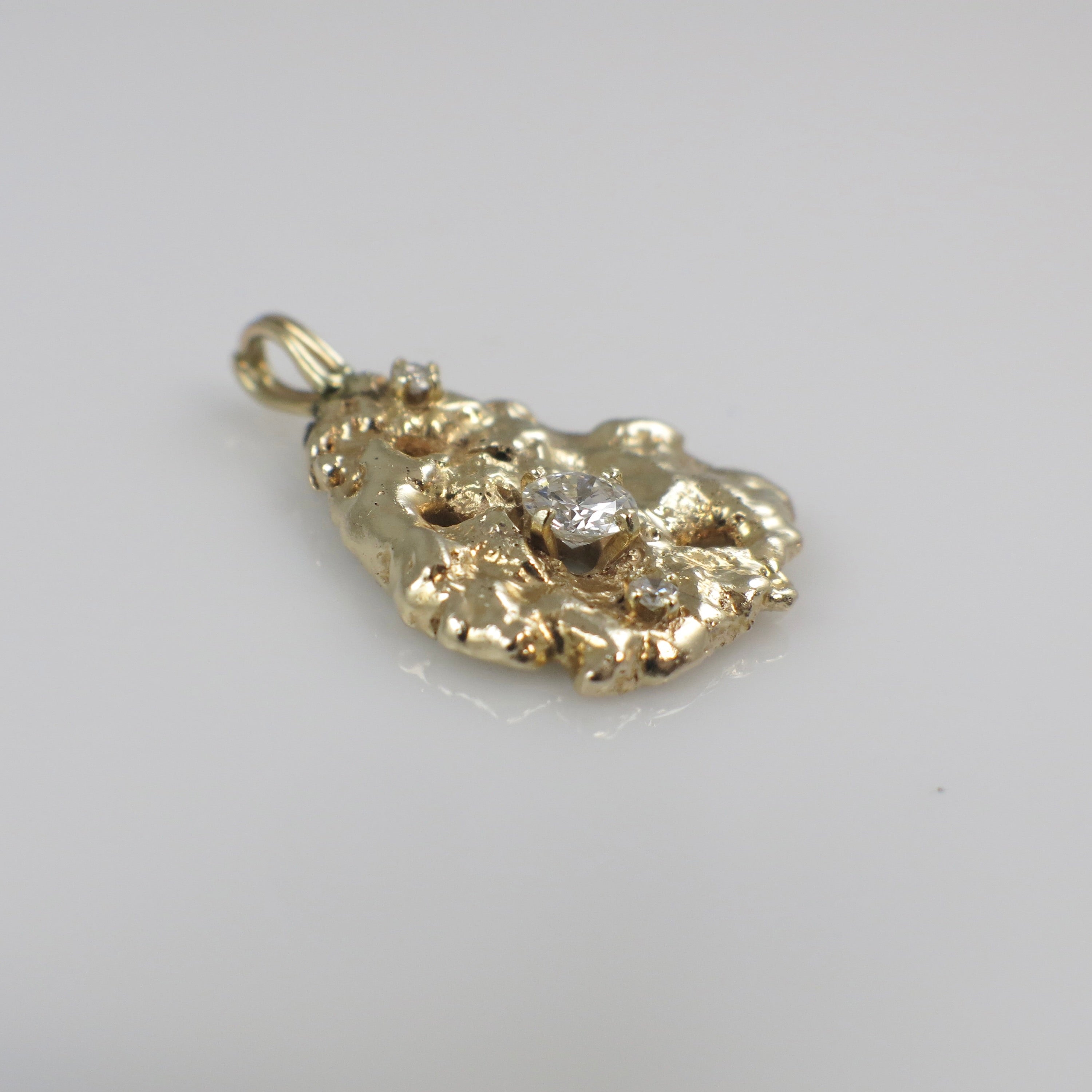 14K yellow gold nugget diamond pendant with 0.53 CTW natural diamonds, showcasing a unique gold and diamond design.