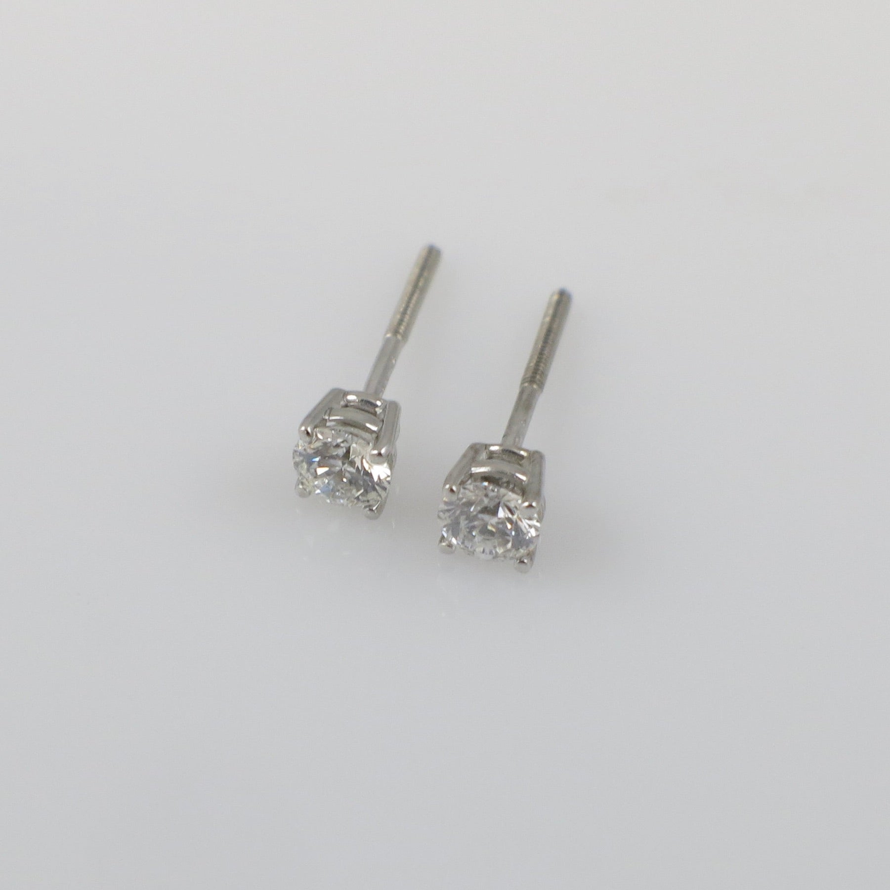 Natural diamond stud earrings with 0.30 CTW in 14K white gold, featuring threaded backs and sparkling round diamonds.