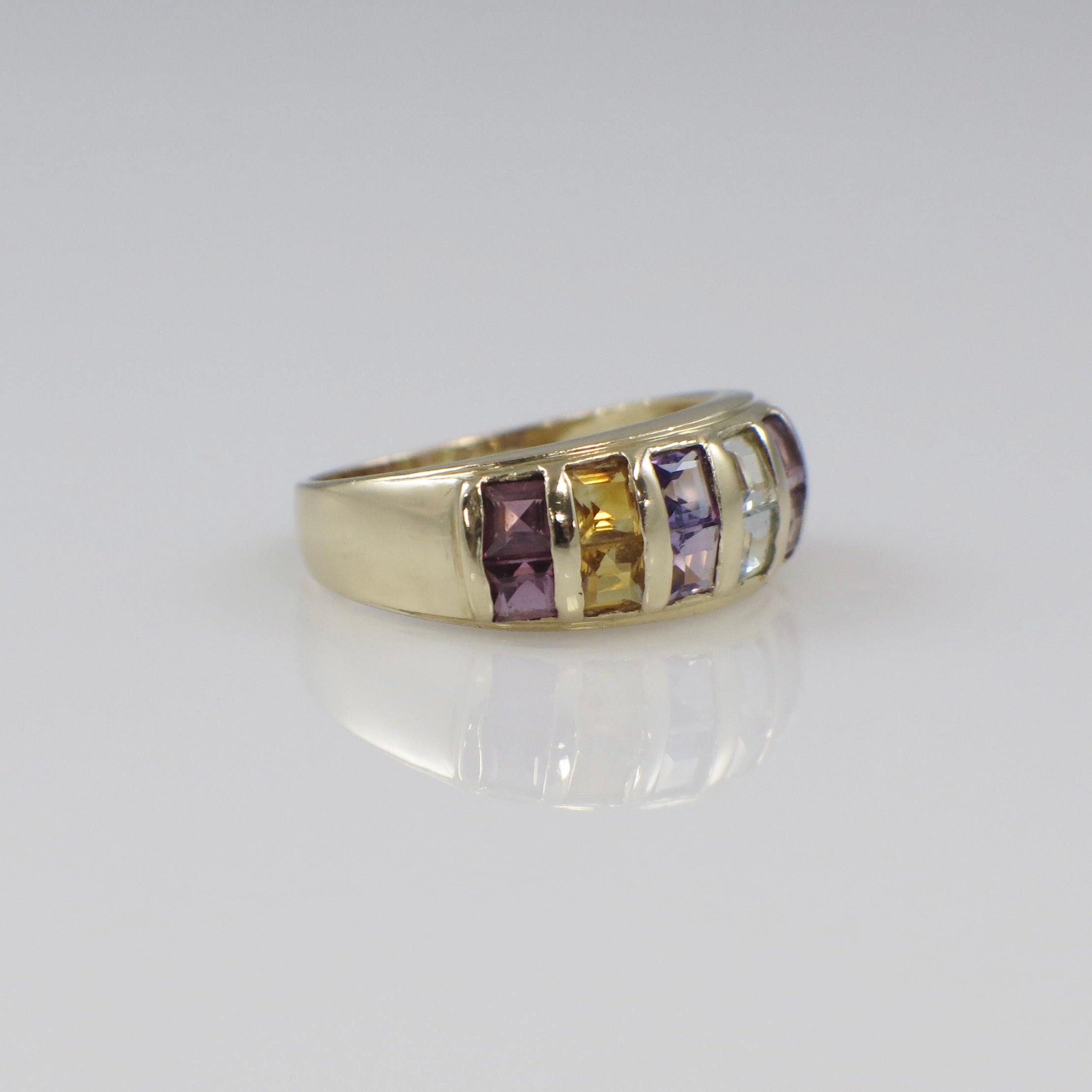 Vintage 14K yellow gold multi-gemstone princess cut ring with vibrant gemstones, crafted by Black Market LLC.