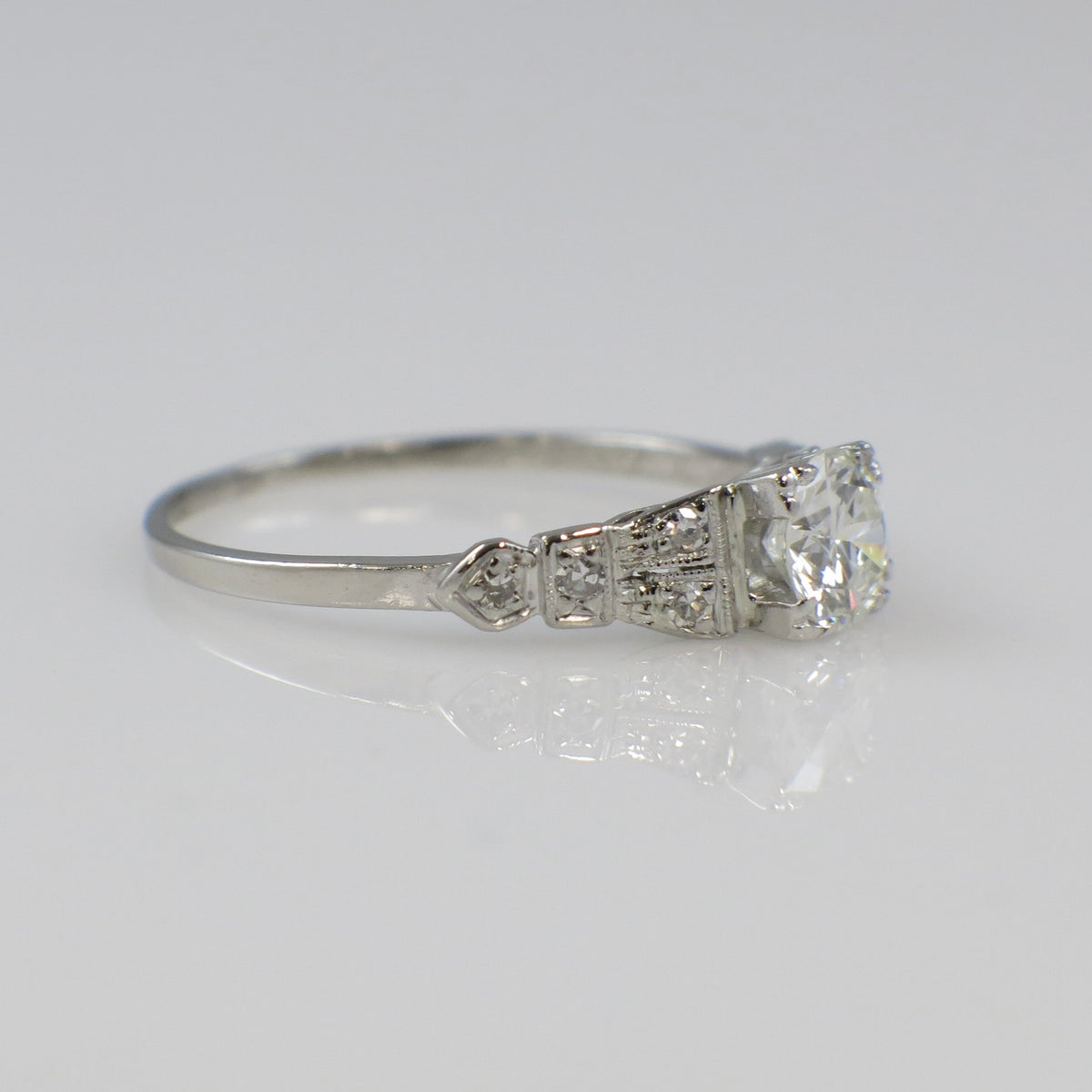 Art Deco platinum diamond engagement ring by Black Market LLC, featuring a 0.63 CTW diamond setting