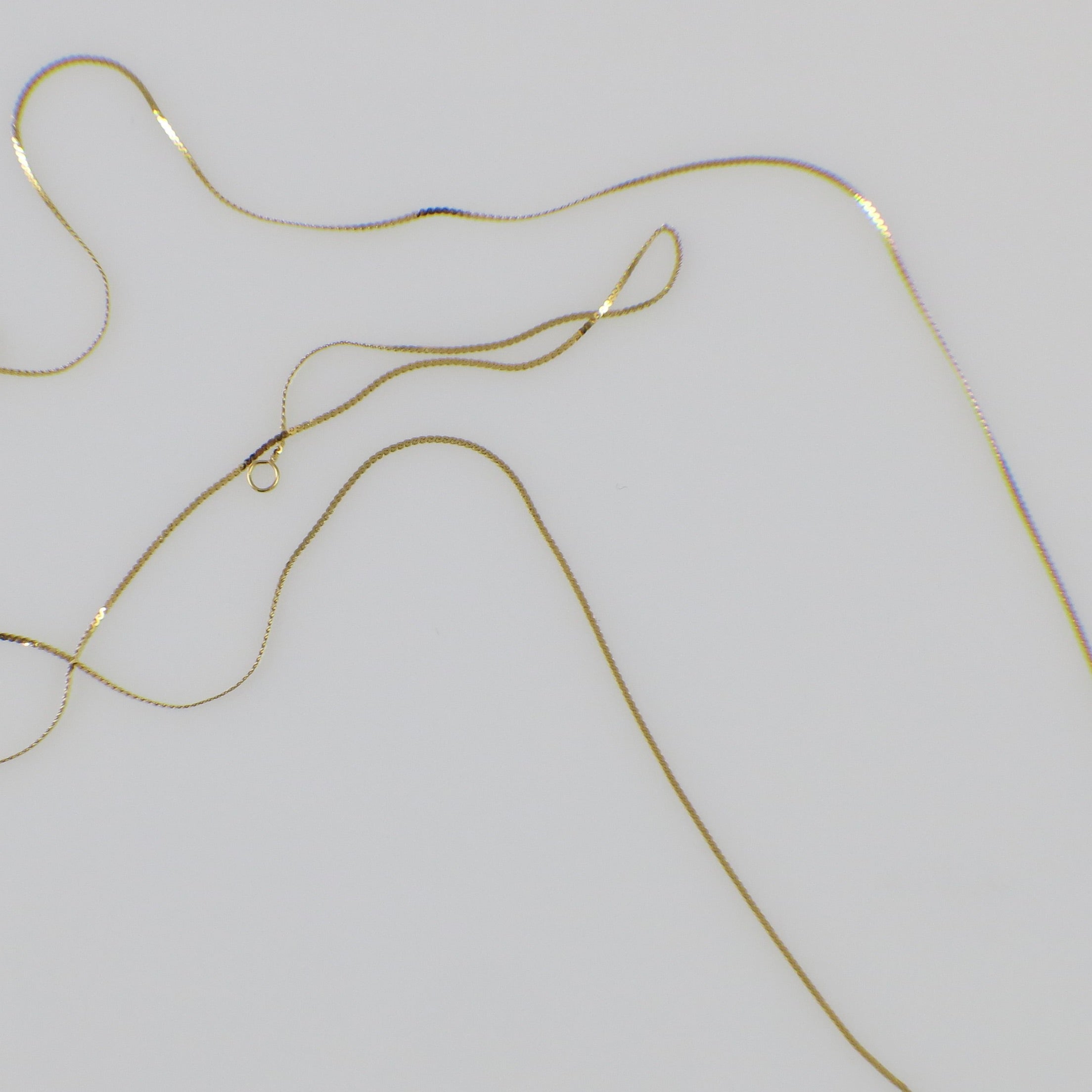 14K yellow gold serpentine chain necklace, 18 inches long, 0.5mm thickness, featuring a delicate, twisted design.