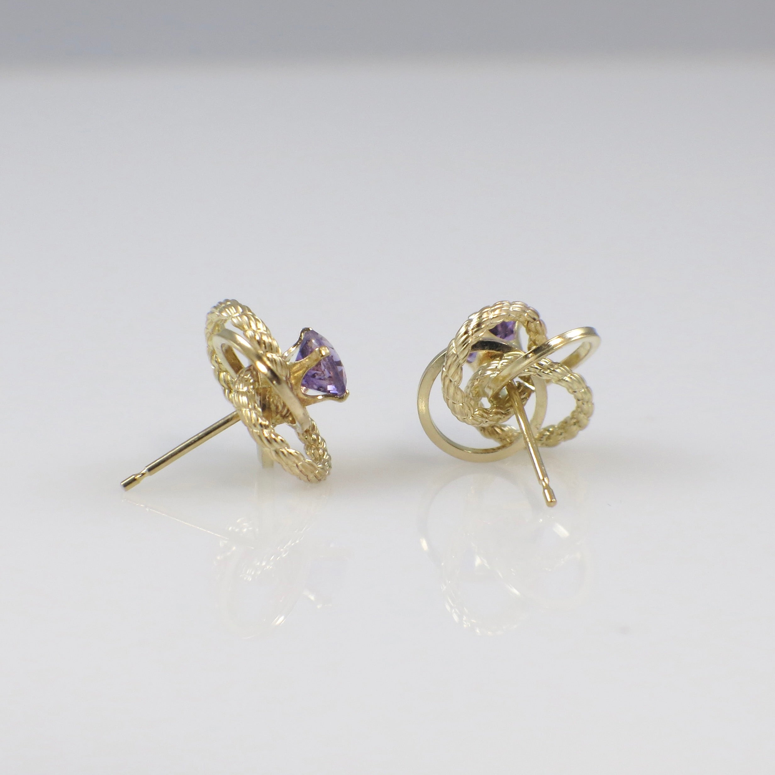 Vintage 14K yellow gold amethyst openwork earrings featuring intricate design and stud style from Black Market LLC.