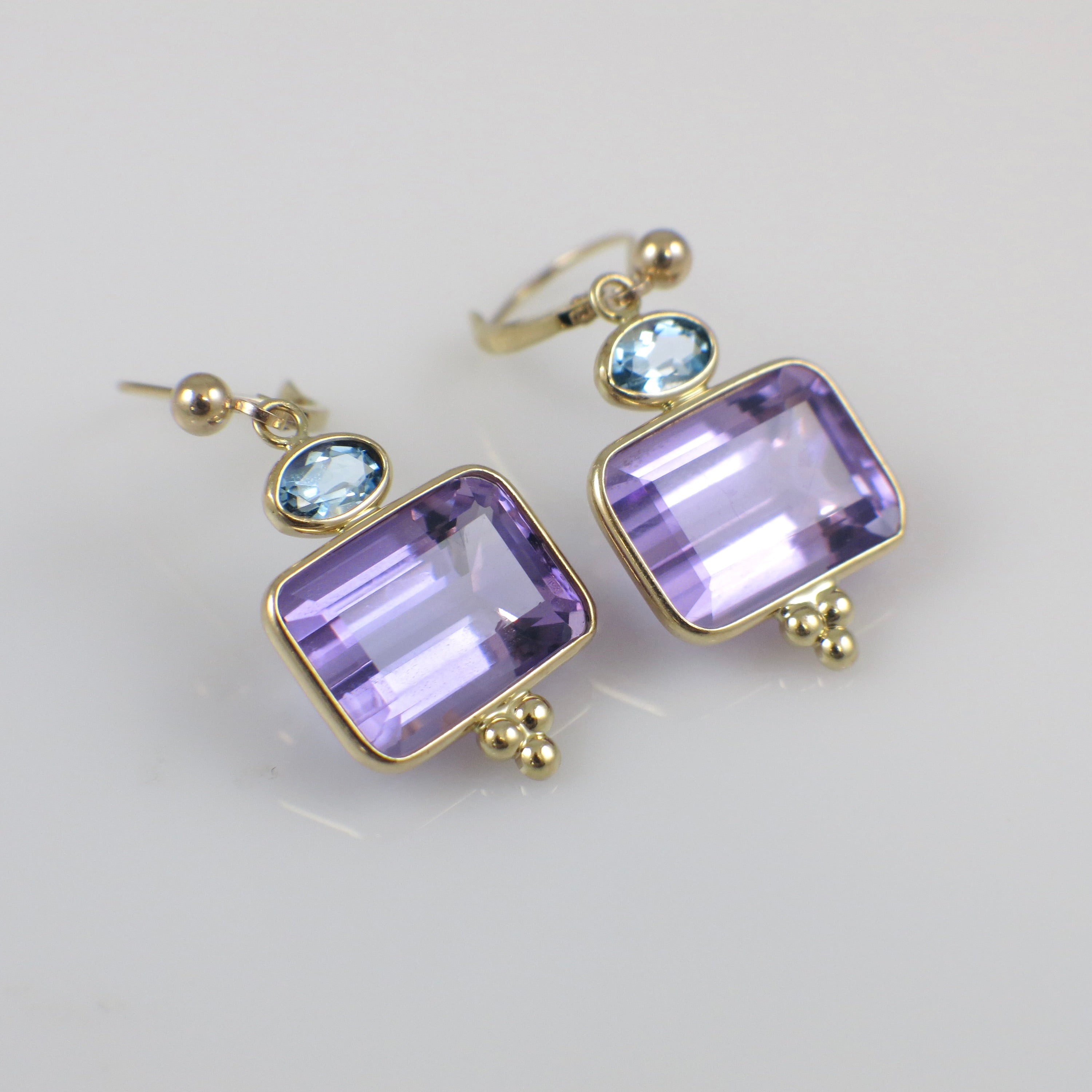 Vintage 14K yellow gold amethyst and topaz drop earrings with intricate design, crafted by Black Market LLC.