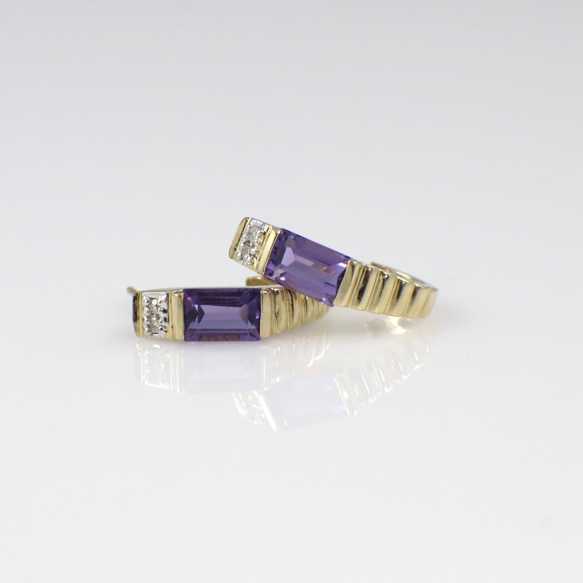 Vintage 14K yellow gold amethyst diamond J hoop earrings with intricate detailing, crafted by Black Market LLC.