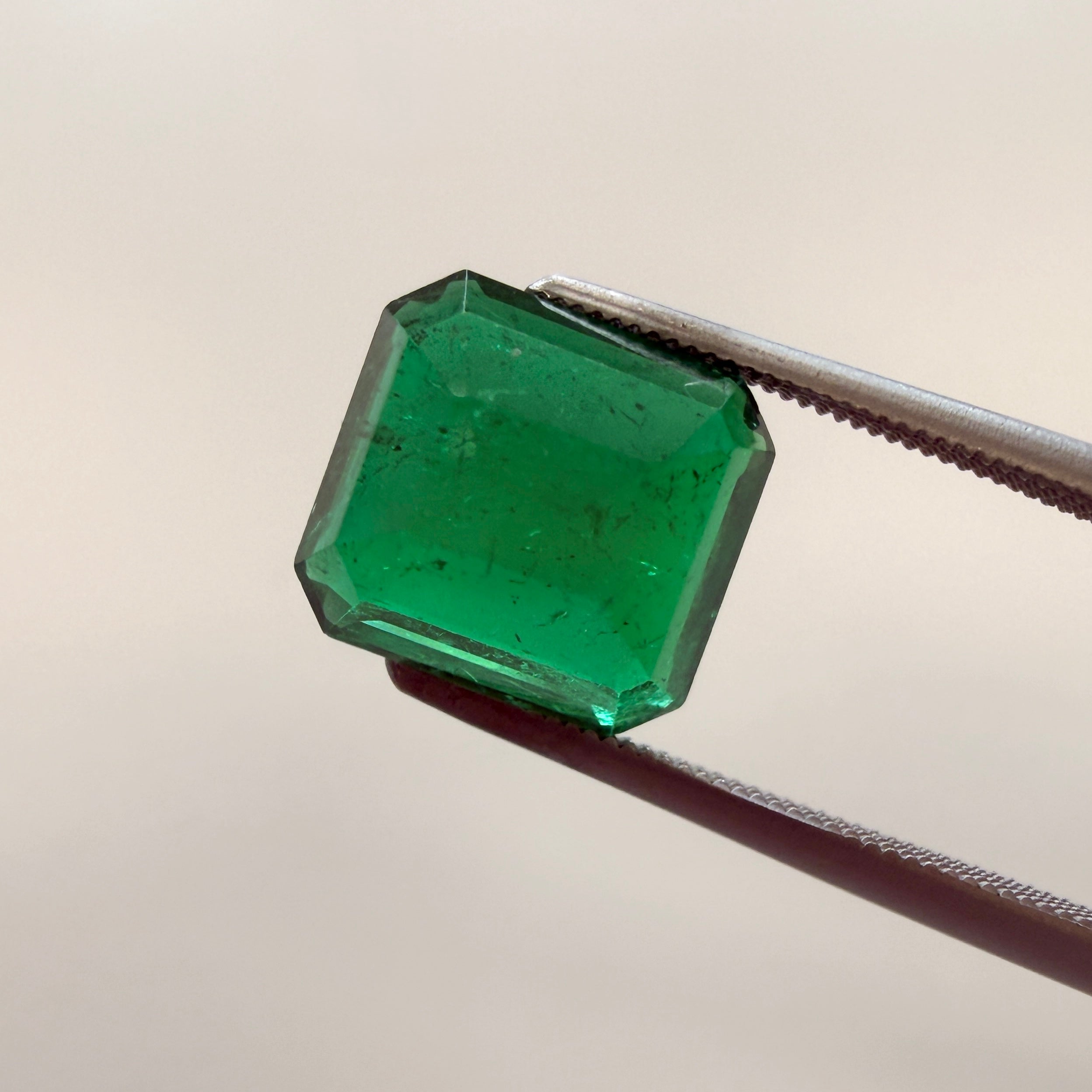 GIA Certified emerald gemstone, 2.43ct octagonal step cut with minor enhancement, measuring 8.44 x 7.85mm, from Black Market LLC.