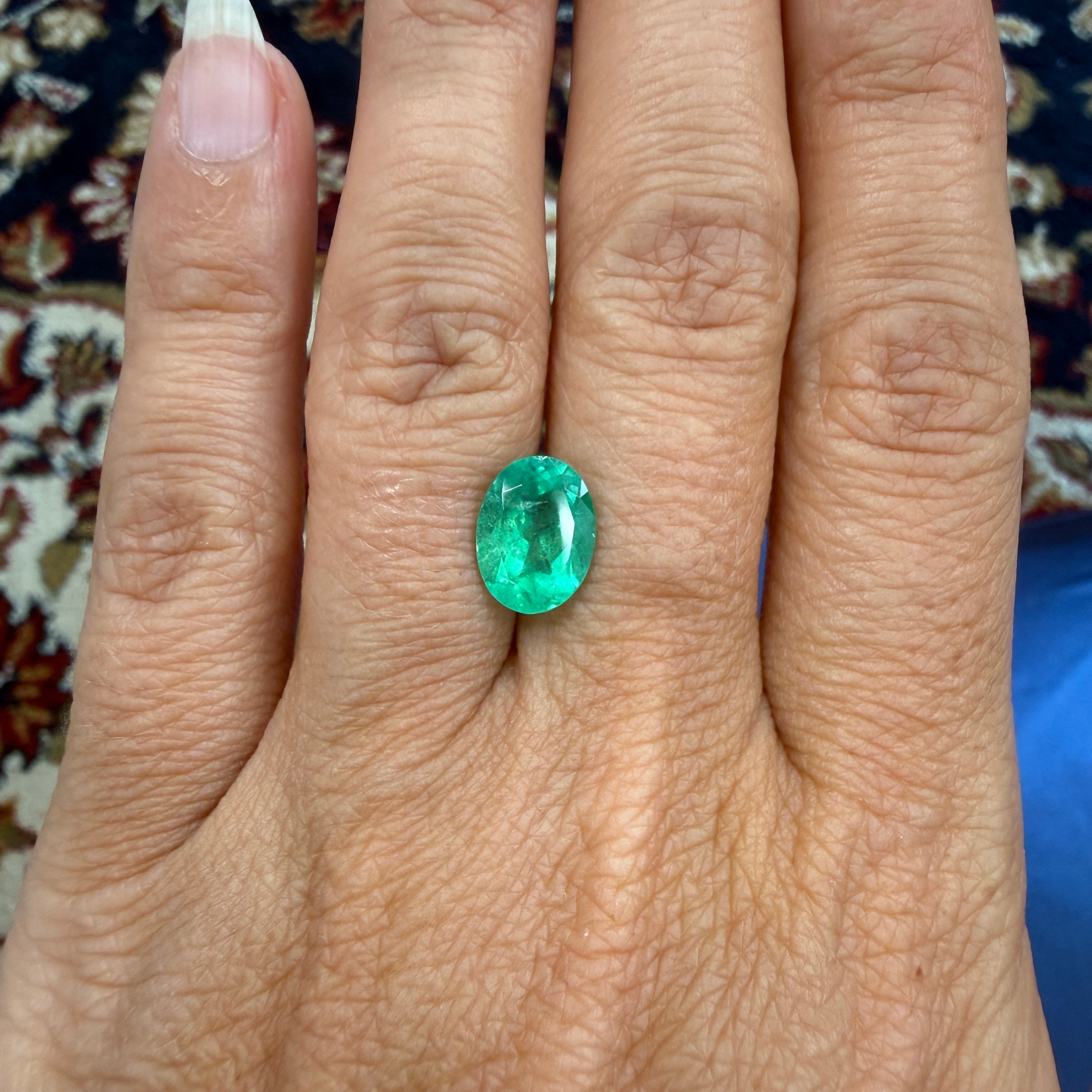 GIA Certified 2.45ct oval green emerald gemstone with minor enhancement, 10.54x7.94mm, from Black Market LLC