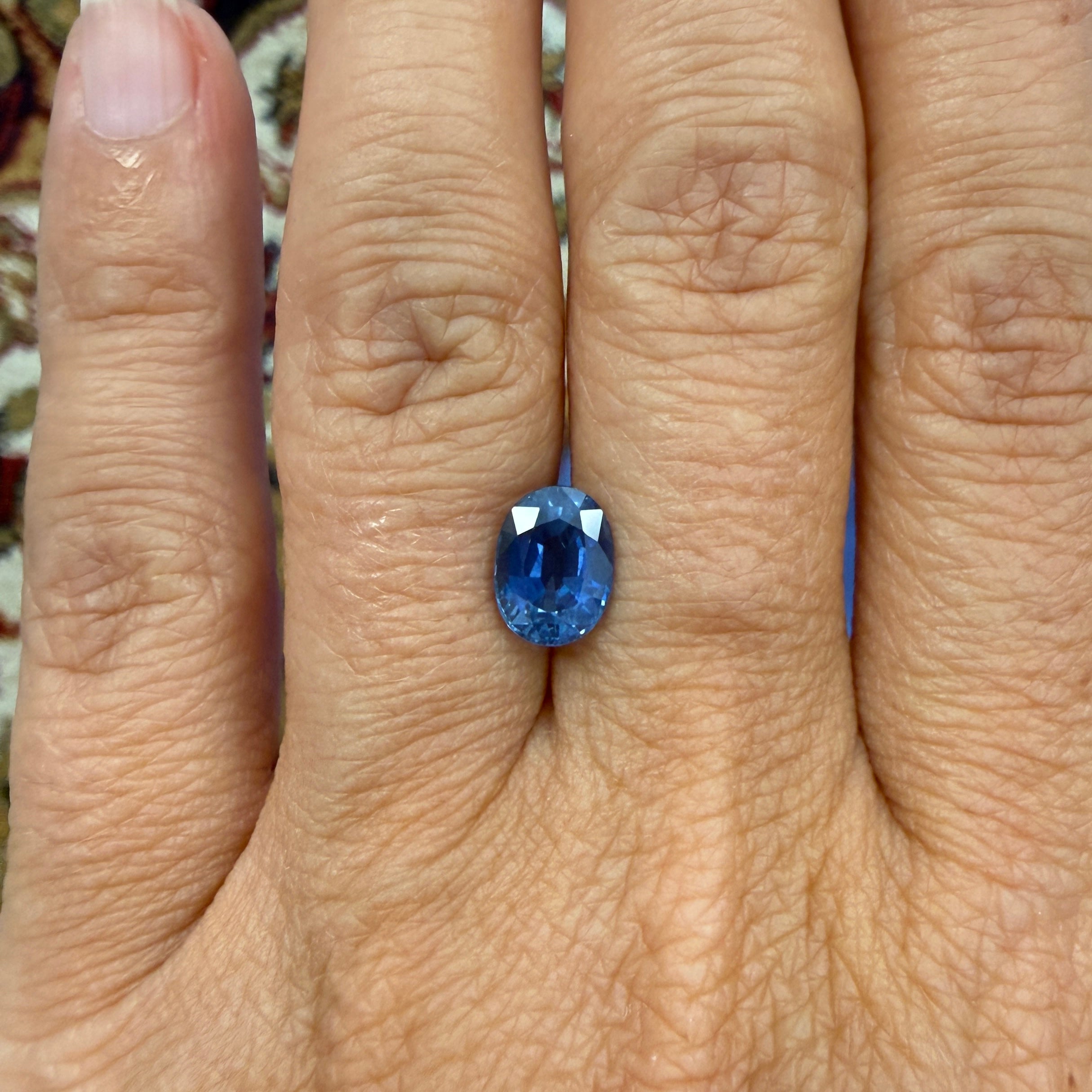 Oval GIA Blue Sapphire gemstone, 2.36ct, heated natural sapphire in a vibrant blue color, from Black Market LLC.