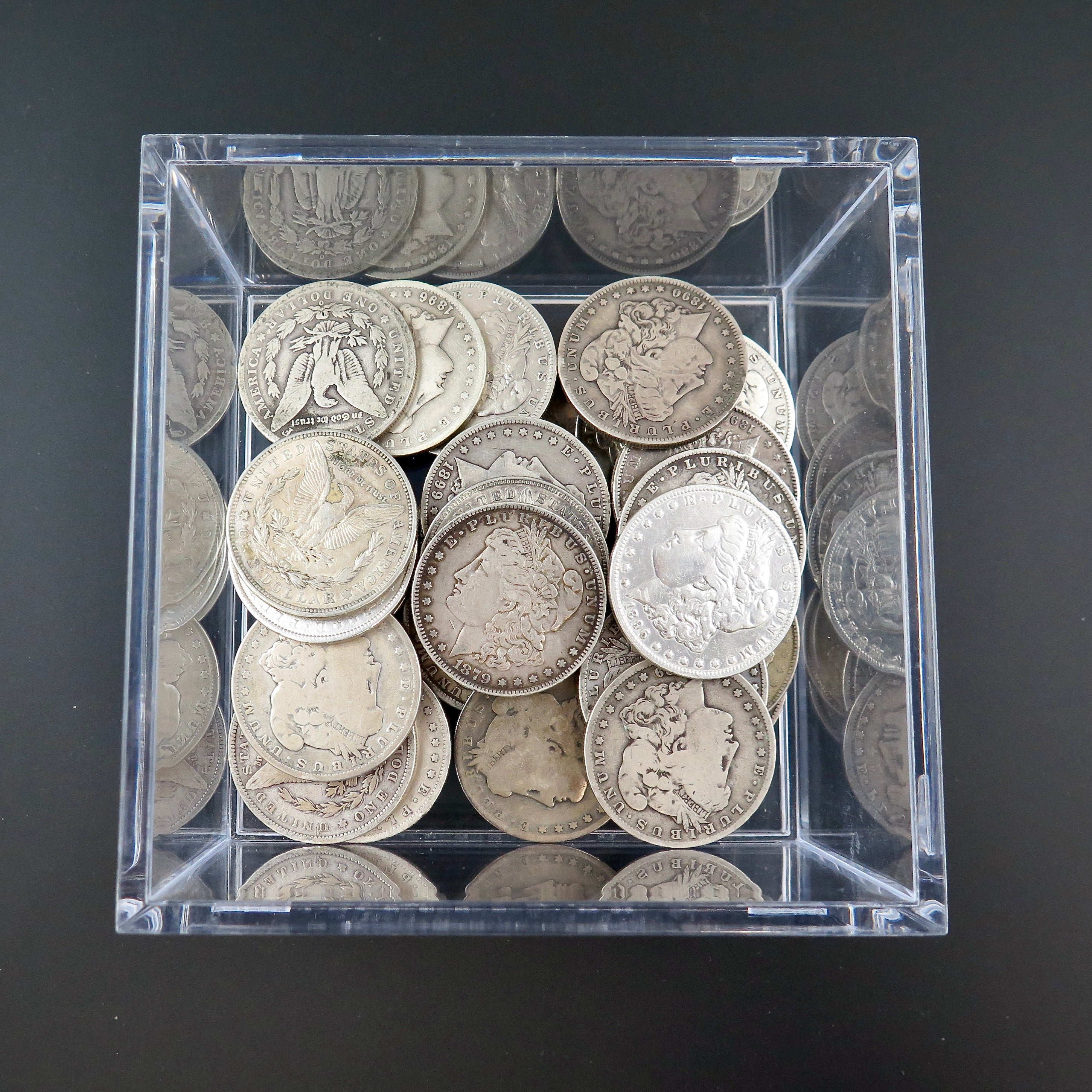 Bulk black market LLC Cull Morgan Silver Dollar, 90% silver, random year 1878–1921, close-up of coin with detailed design.