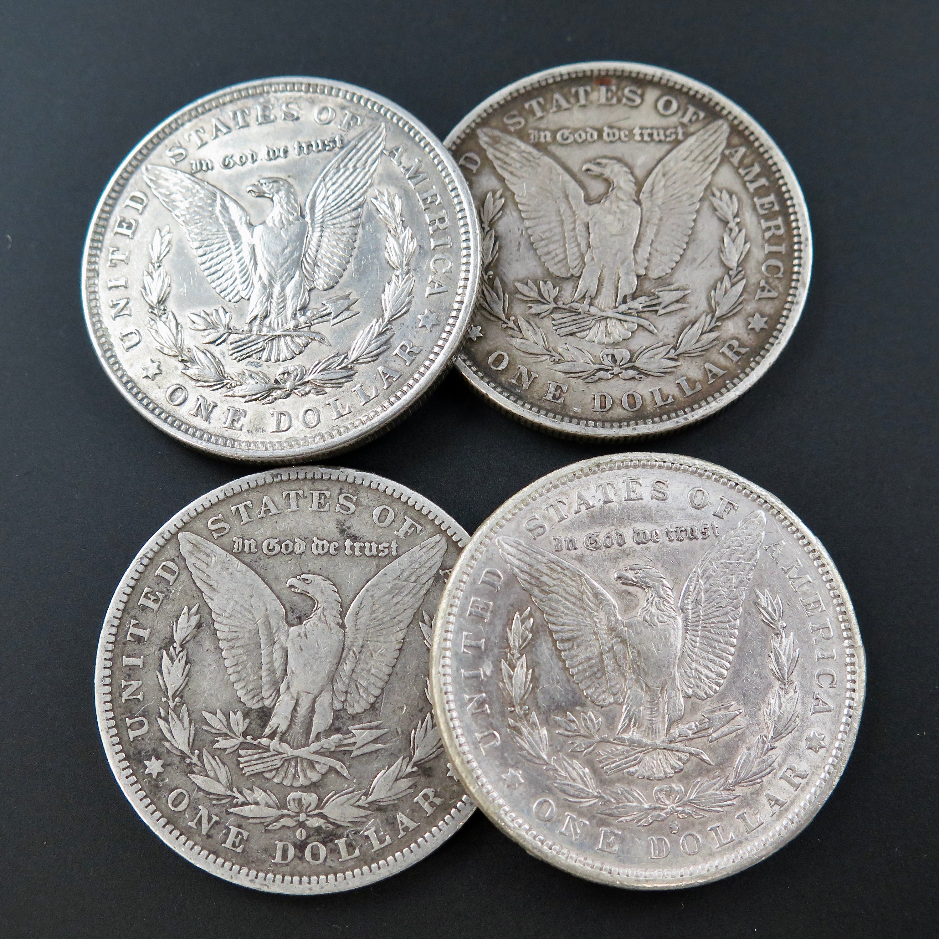 Bulk collection of Cull Morgan Silver Dollars from Black Market LLC, featuring random years from 1878 to 1921, 90% silver.