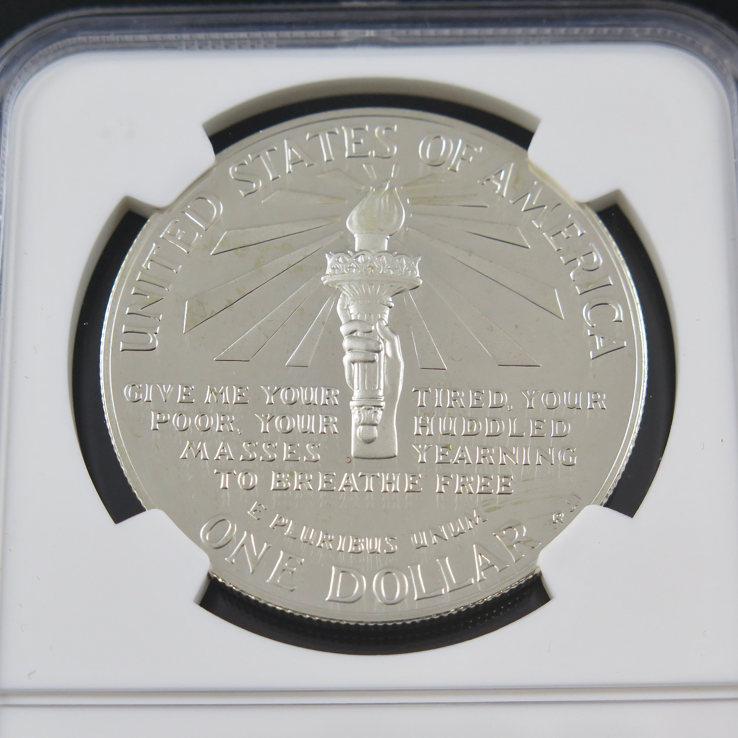 Silver dollar coin 1986-S Liberty Silver Dollar PF69 Ultra Cameo, commemorative coin from Black Market LLC, showing detailed design.