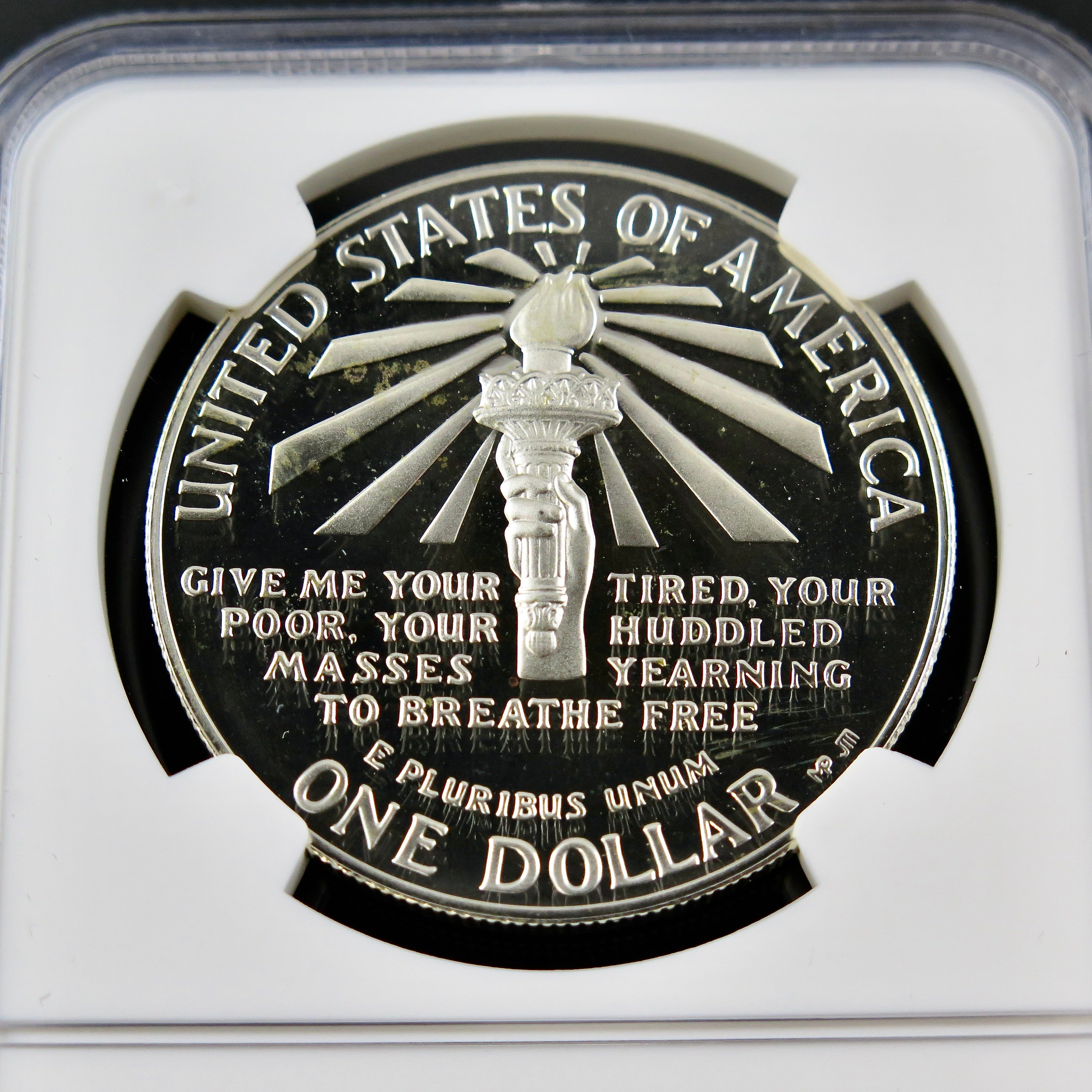 Silver Dollar 1986-S Liberty commemorative coin in PF69 Ultra Cameo grade, featuring detailed design and NGC certification.