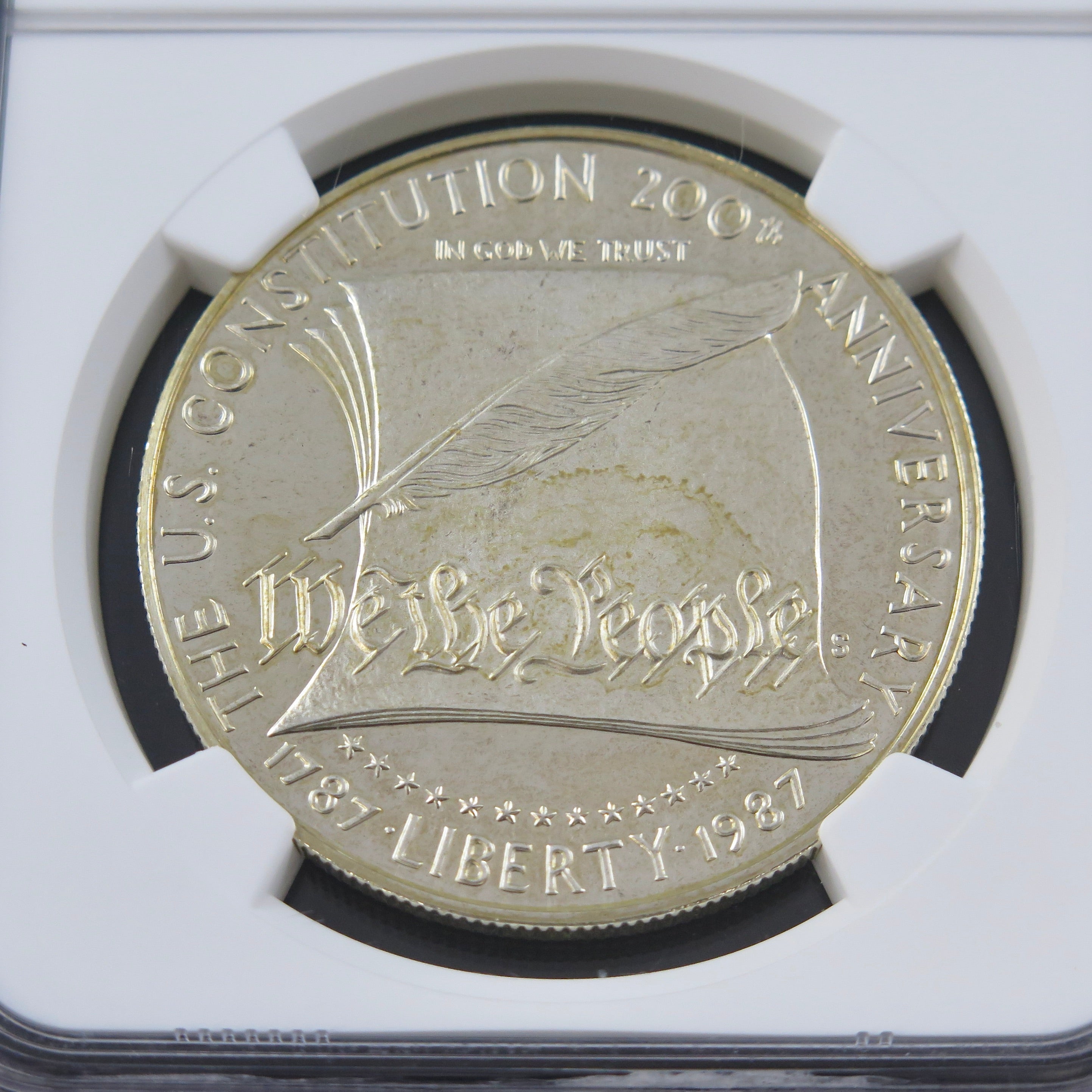 Silver dollar coin, 1987-S Constitution commemorative, PF69 Ultra Cameo grade, NGC certification, displayed with detailed design.