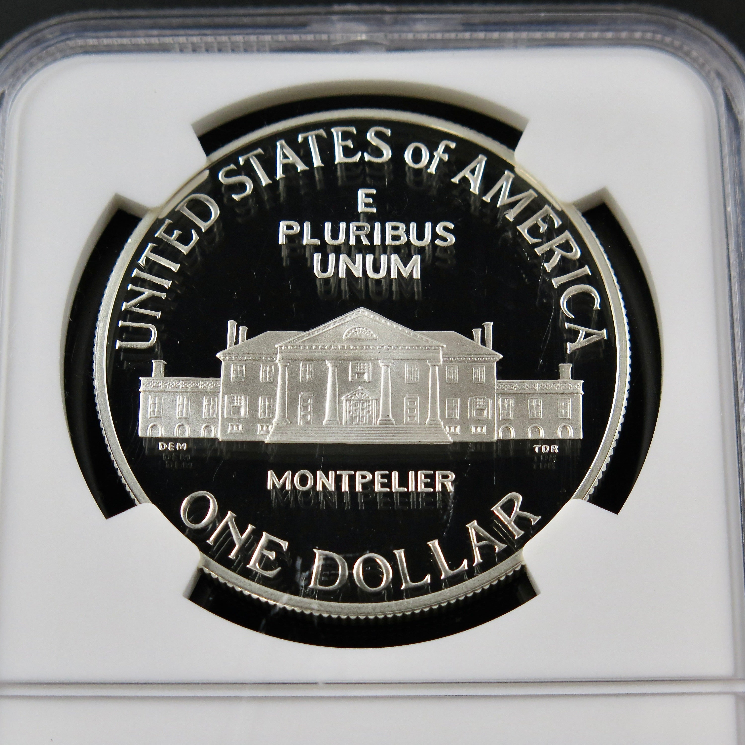 Close-up of the James Madison Silver Dollar 1993-S PF69 NGC Ultra Cameo commemorative coin showing detailed design and surfaces.