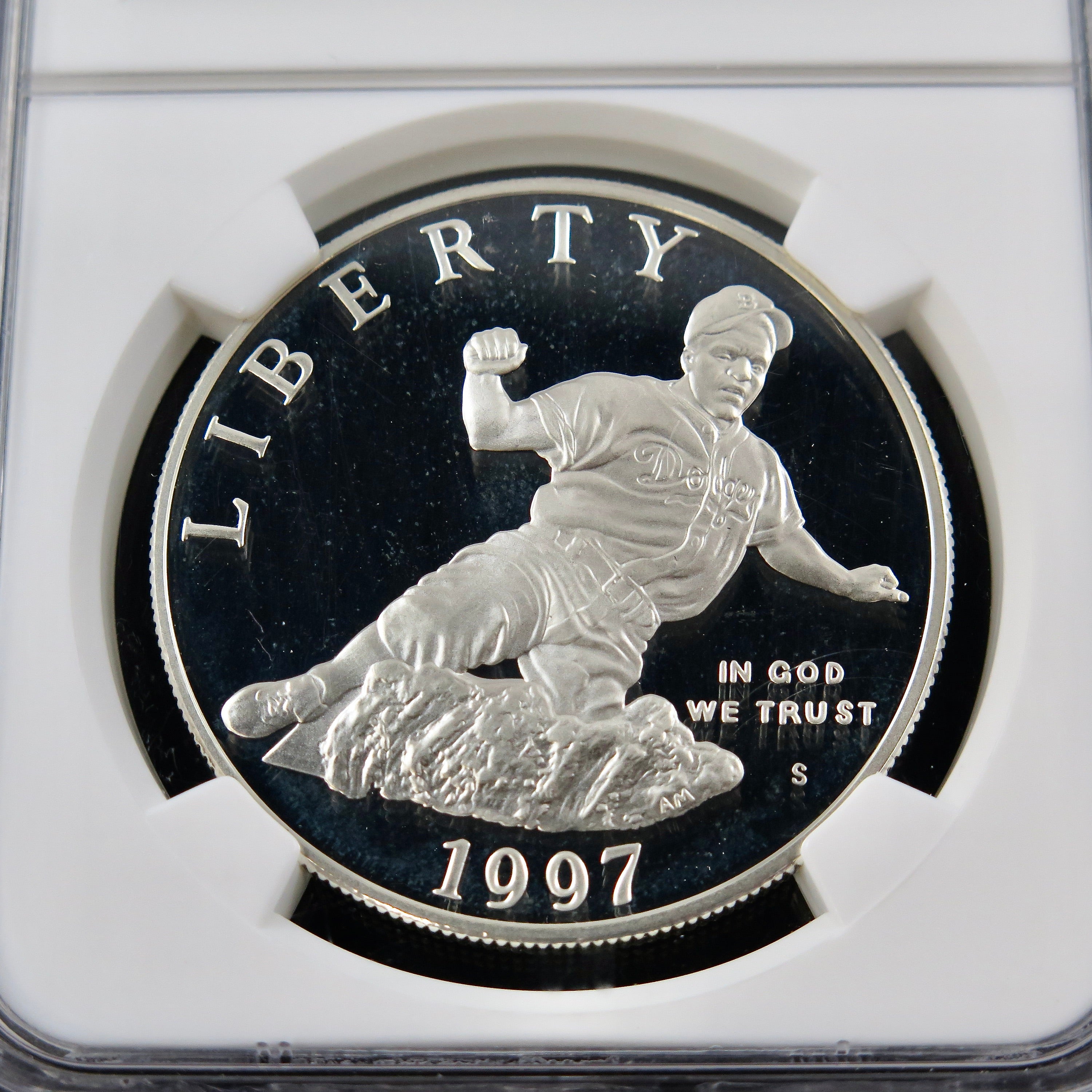Silver Jackie Robinson commemorative dollar coin, 1997-S PF69 NGC Ultra Cameo, showcasing detailed image and mint mark.