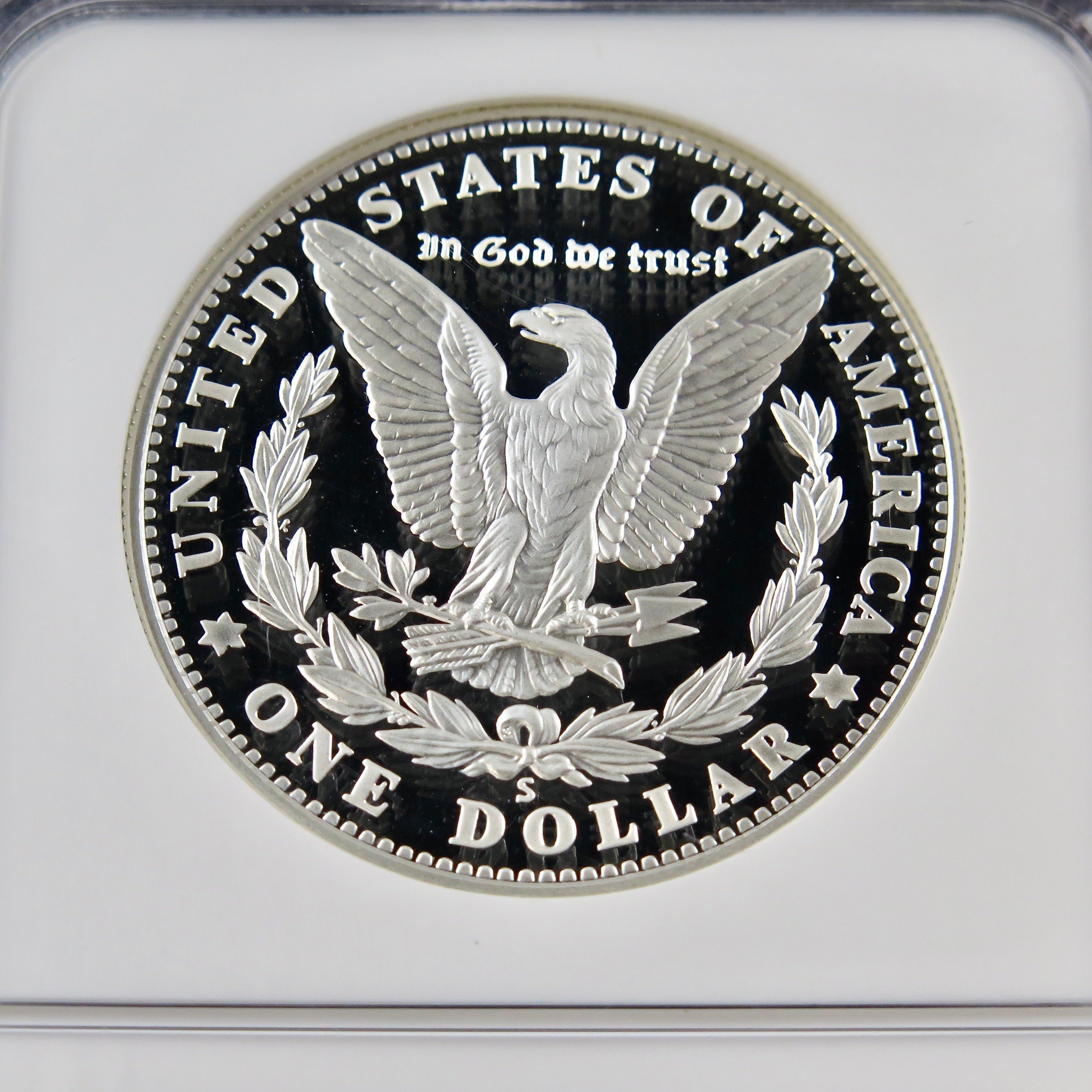 Close-up of the San Francisco Old Mint Silver Dollar 2006-S commemorative coin in PF70 proof grade by NGC, showing detailed minting.