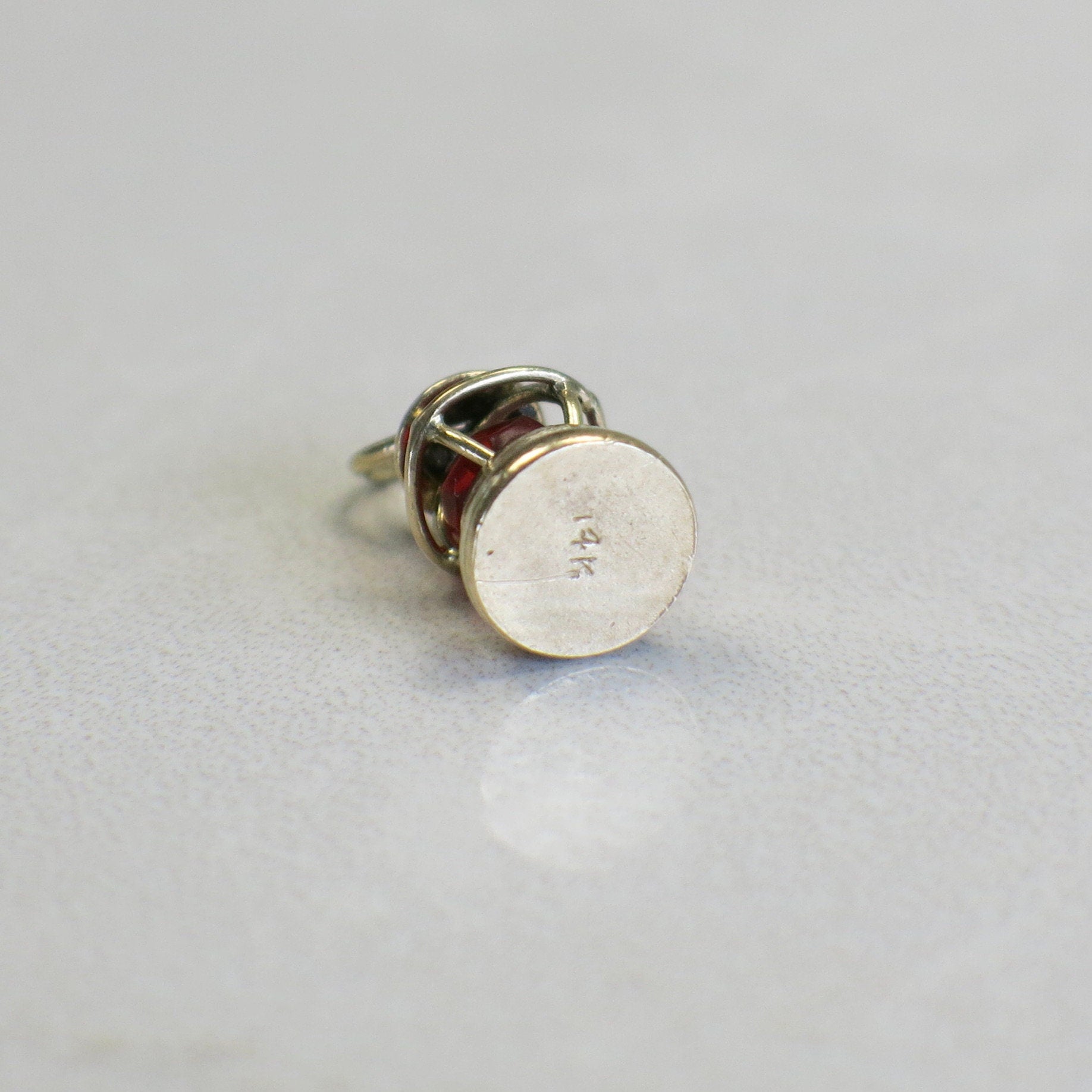 14K yellow gold nautical lantern charm with vintage red glass bead pendant, featuring intricate detailing and a secure loop.