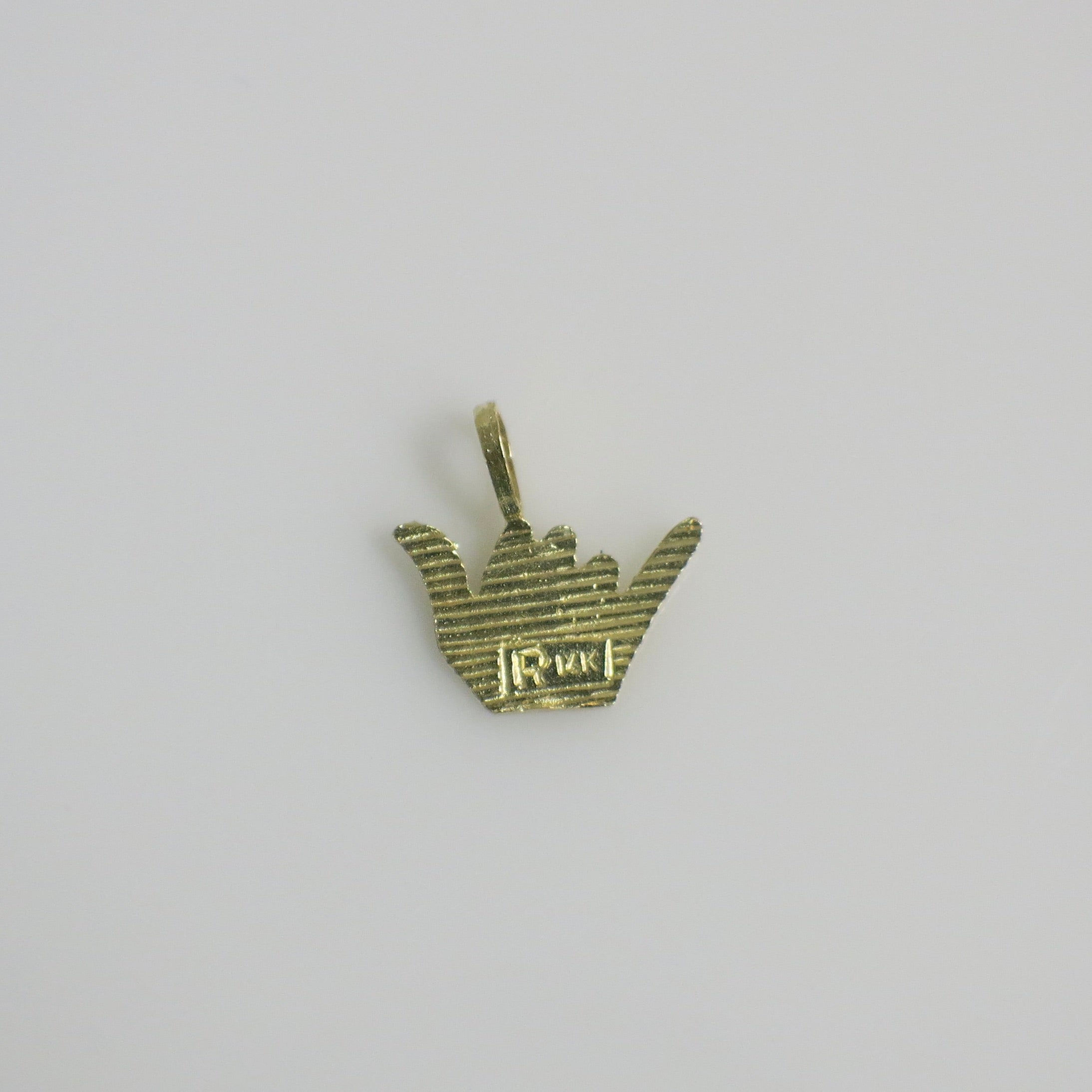 14K yellow gold vintage Shaka sign charm, 1/2 inch, from Black Market LLC, detailed gold charm with hand gesture design.