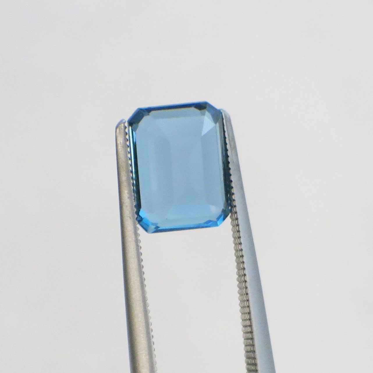 2.08 carat emerald cut blue topaz loose gemstone, 8x6mm, December birthstone, by Black Market LLC