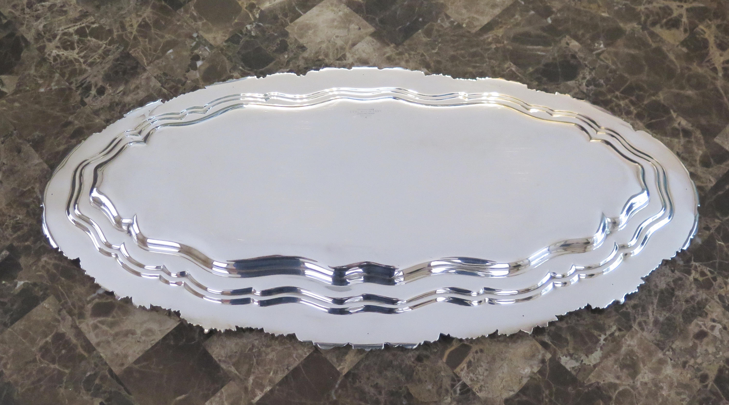 Antique Tiffany & Co. Chrysanthemum sterling silver fish platter, ornate 26-inch tray with detailed floral engravings from 1879–1880.