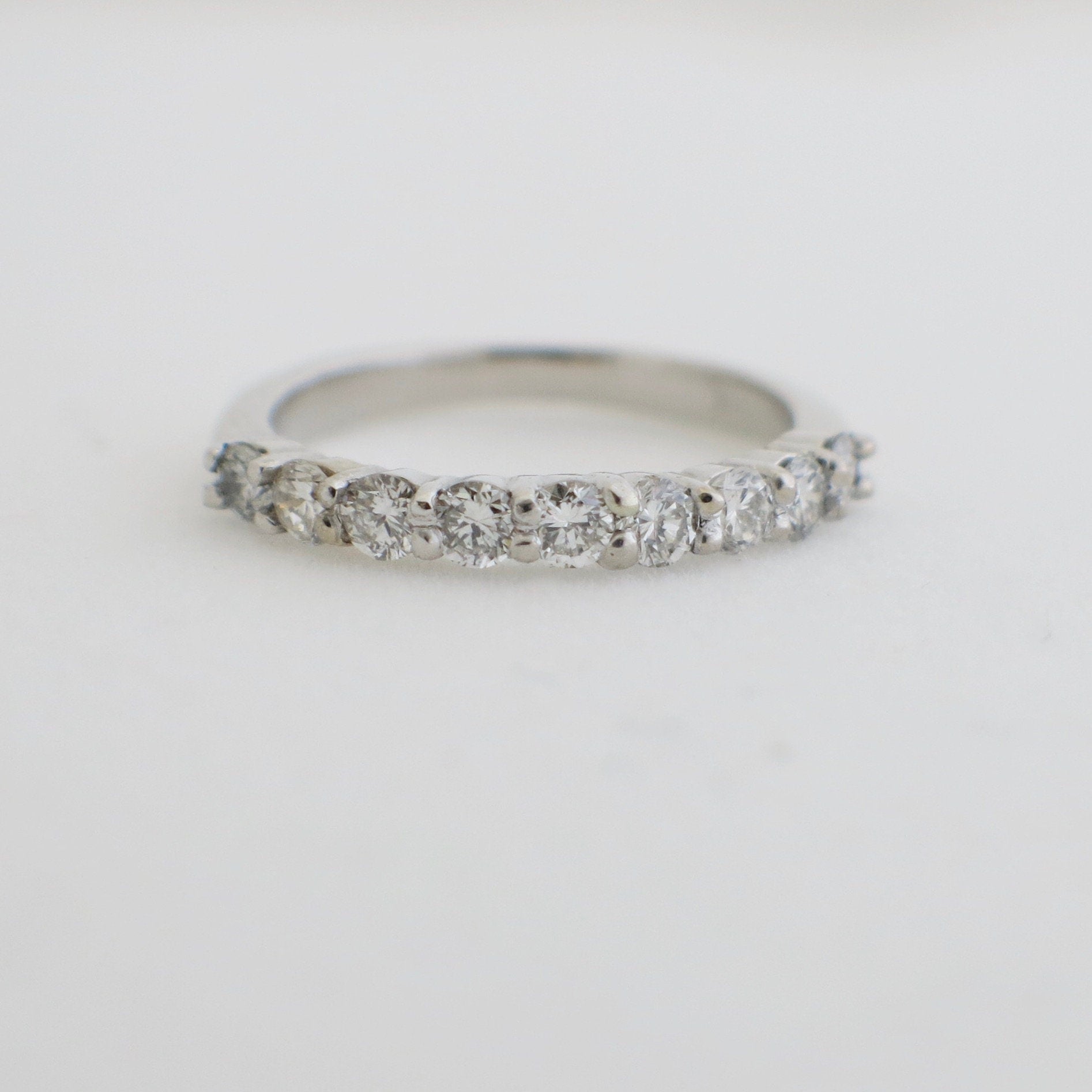 14K white gold 9-stone diamond wedding band with shared prongs, 0.45 CTW, size 4.5, stackable diamond ring from Black Market LLC.