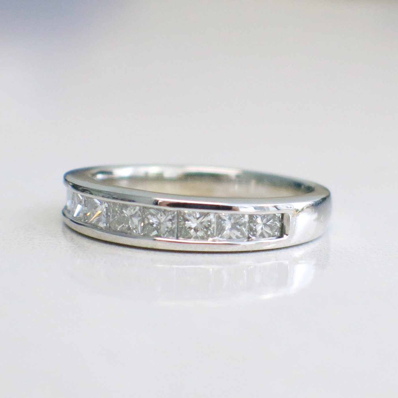 14K white gold princess cut diamond band with channel-set diamonds, .90 CTW, size 6.75 wedding ring from Black Market LLC.