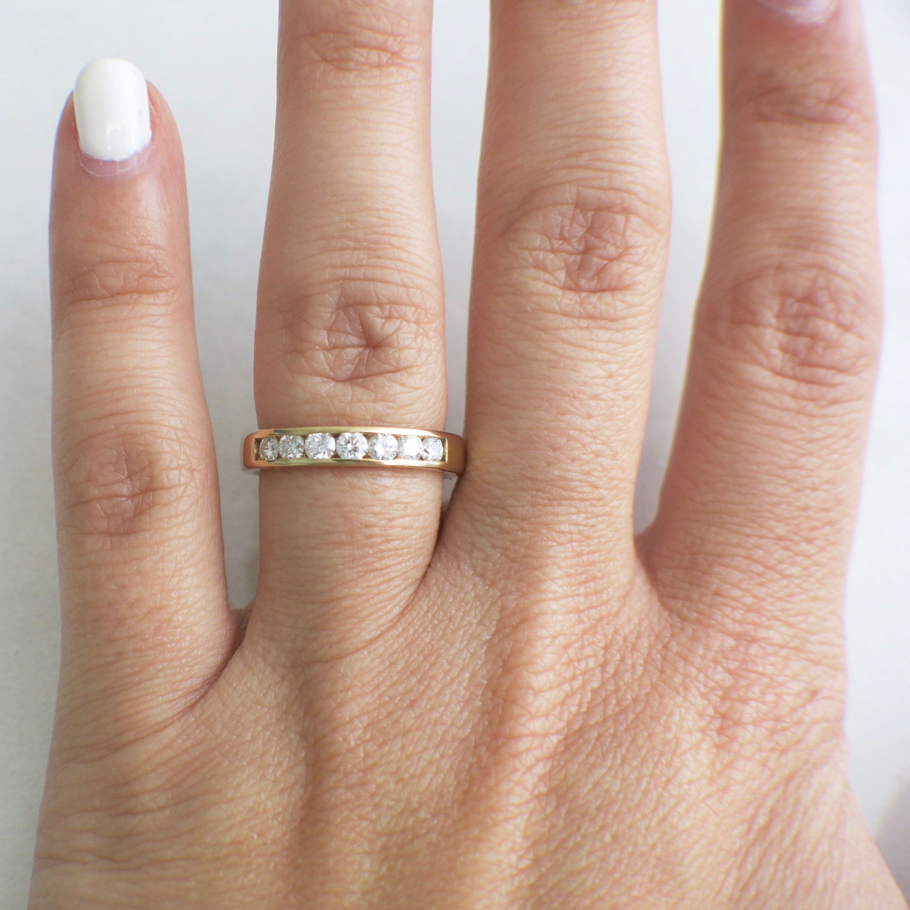 14K yellow gold diamond channel set band ring with .70 CTW, size 6, featuring sparkling diamonds in a sleek design.