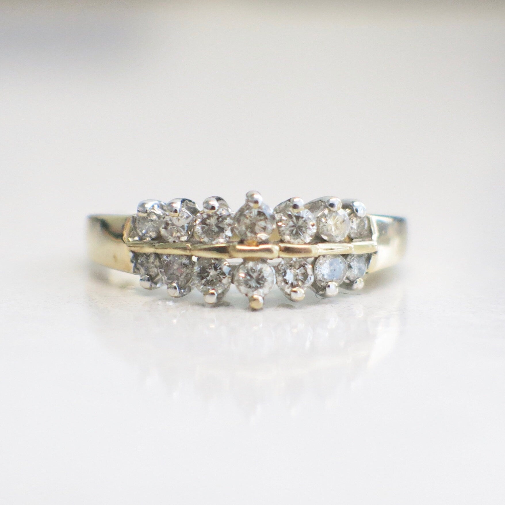 Vintage 14K yellow gold diamond double row ring with graduated band and .36 CTW, size 6.5, from Black Market LLC.