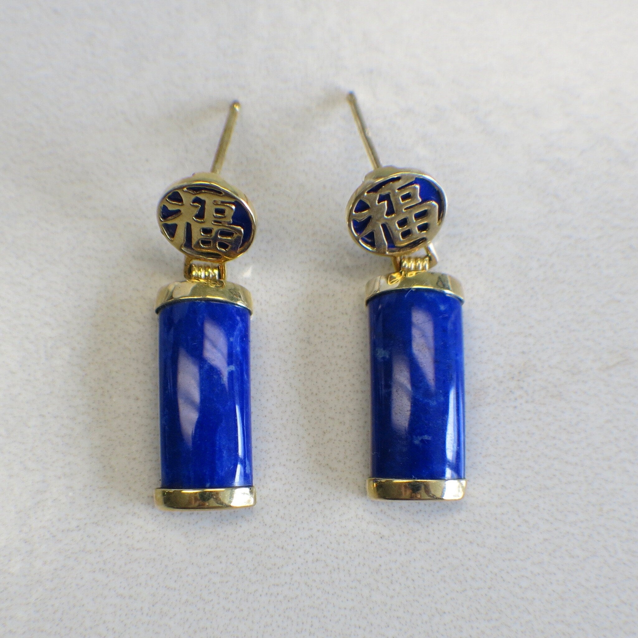14K yellow gold lapis lazuli earrings with vintage dangle design and Chinese symbol accents from Black Market LLC.