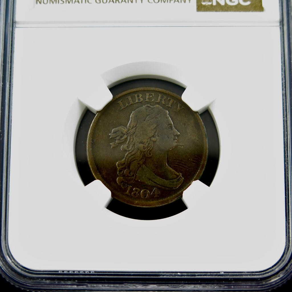1804 Draped Bust Half Cent with spiked chin, graded VG details by NGC, featuring classic coin design and patina.