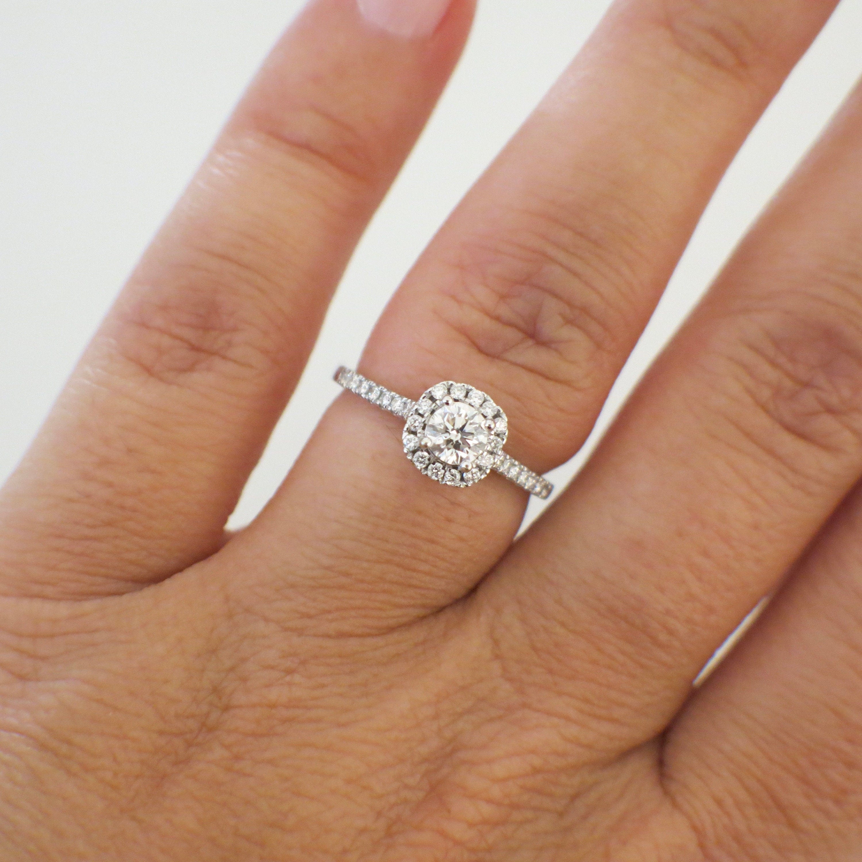 Lillian James bridal 14K white gold diamond halo engagement ring with round brilliant center stone, petite design, size 5.25.