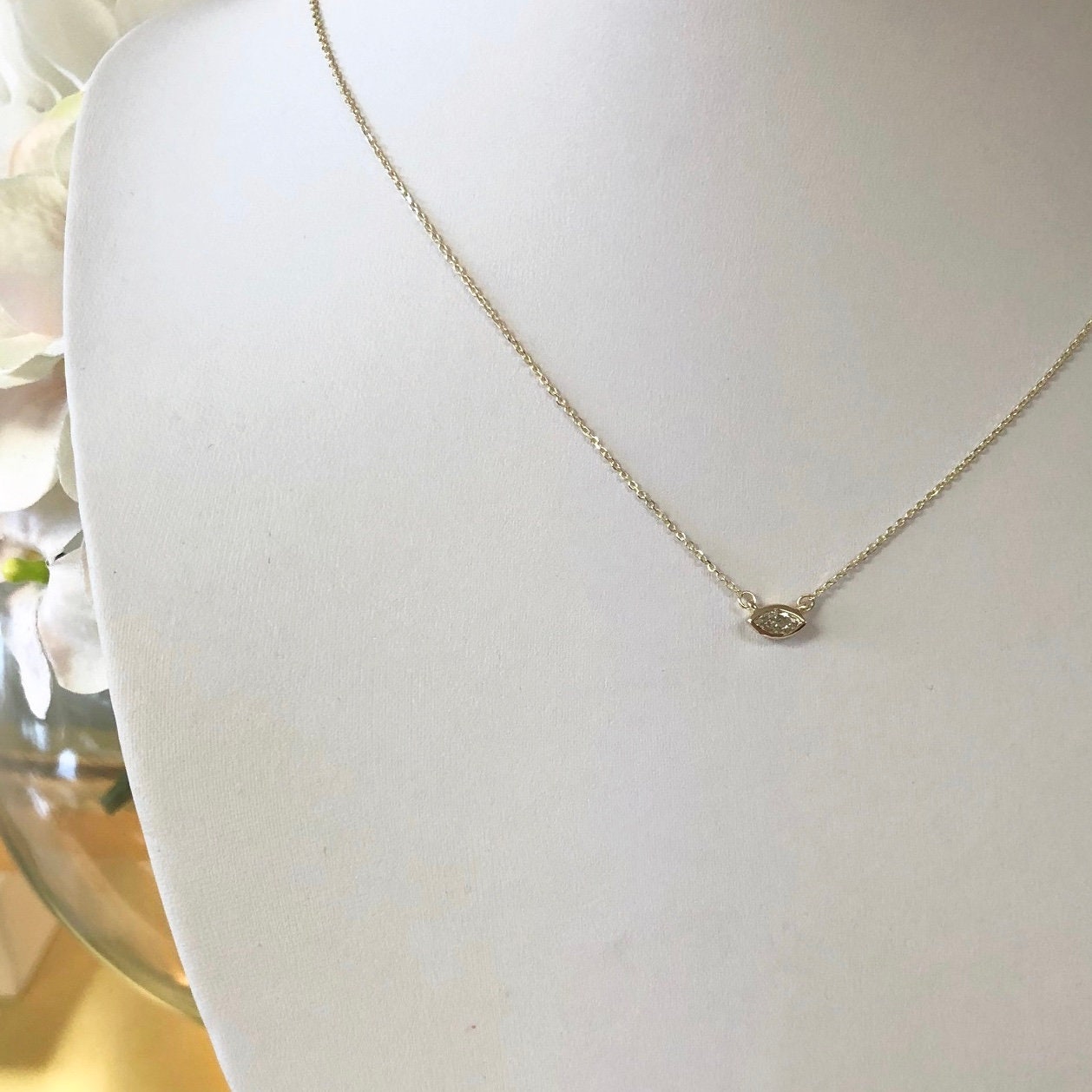 14K gold east-west marquise diamond bezel necklace with solitaire pendant, elegant jewelry by Black Market LLC.