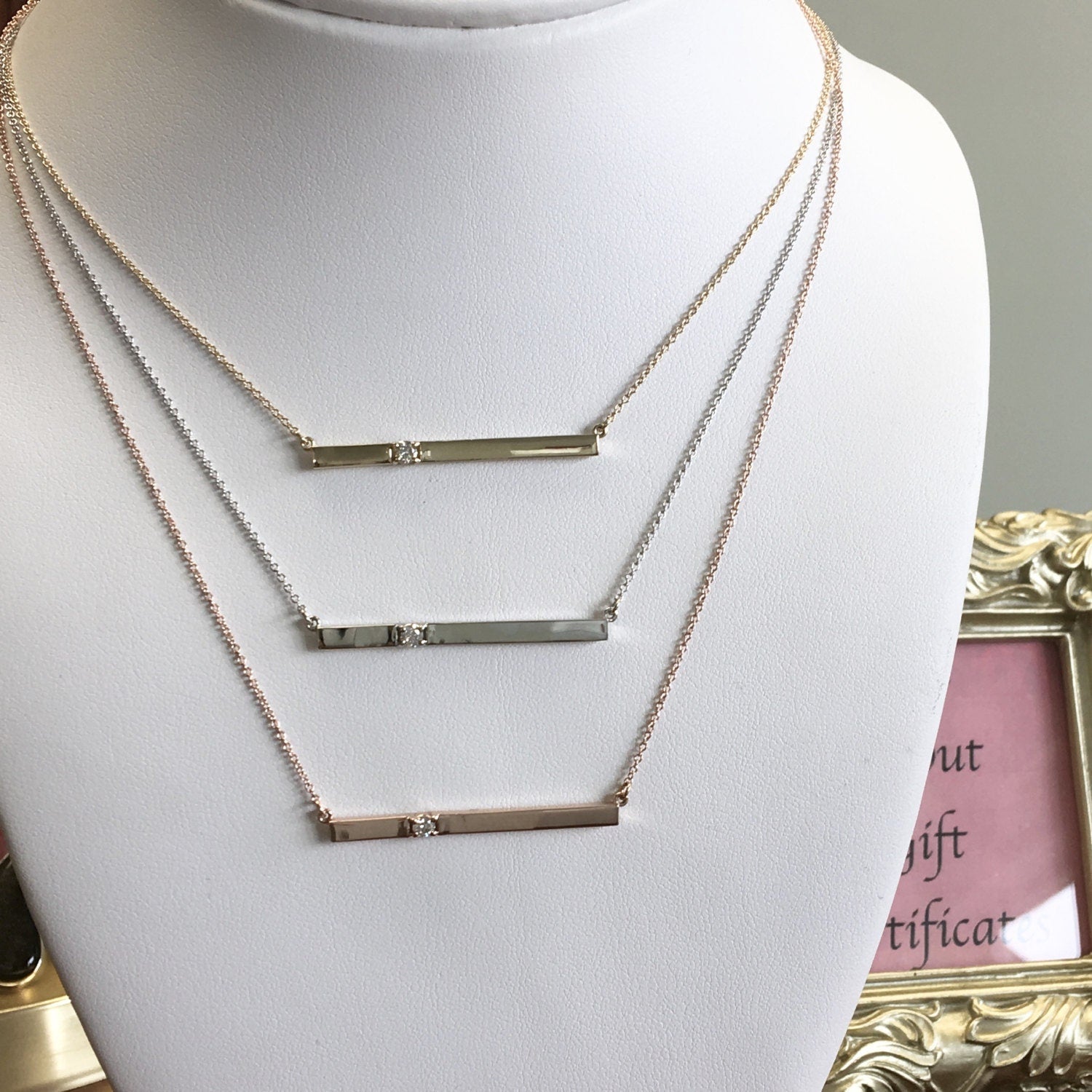 14K gold diamond bar necklace by Black Market LLC, minimalist layering pendant with 0.10 CTW diamonds, yellow gold jewelry.