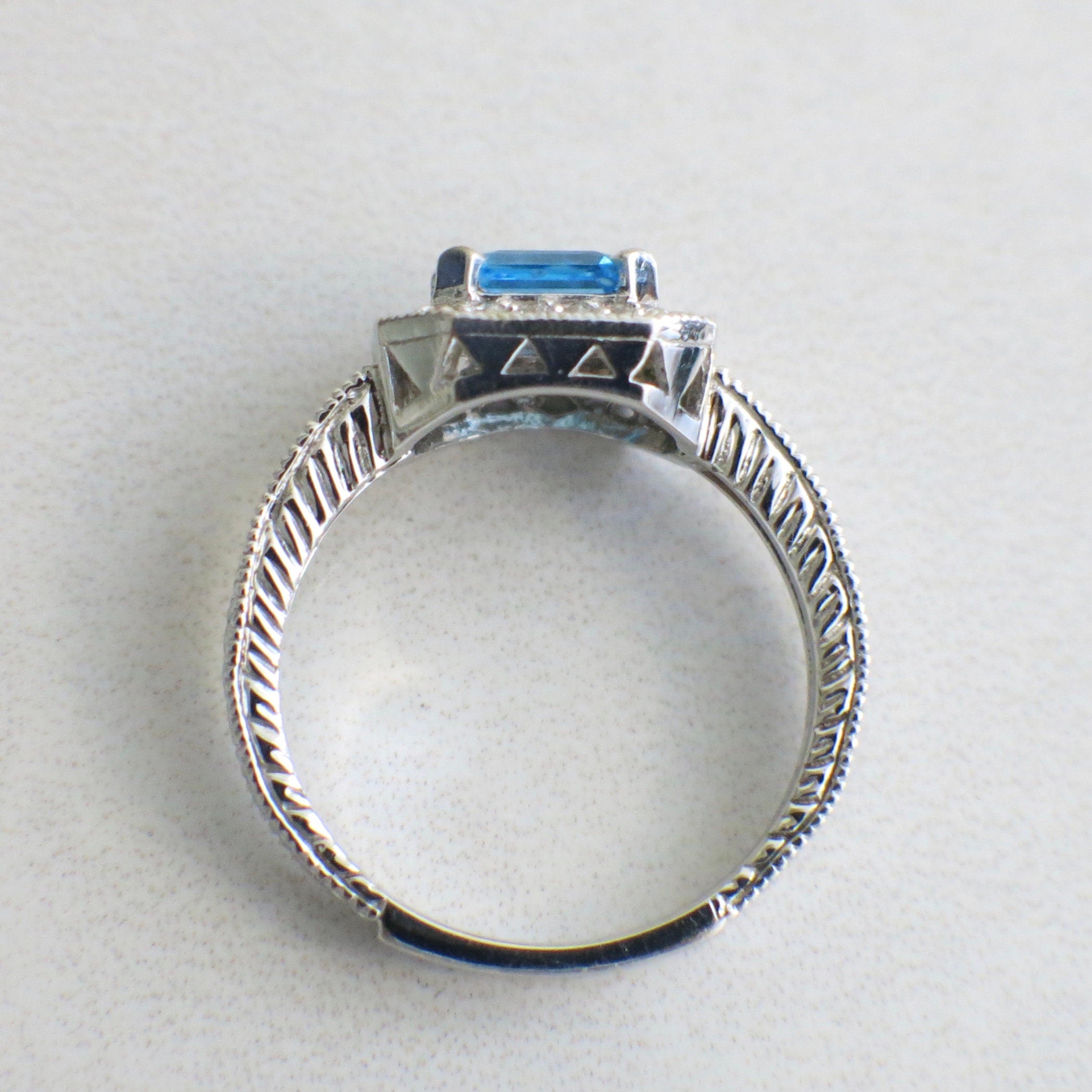 14K white gold Swiss Blue Topaz and diamond ring with east-west halo, size 8.5, featuring elegant jewelry design by Black Market LLC