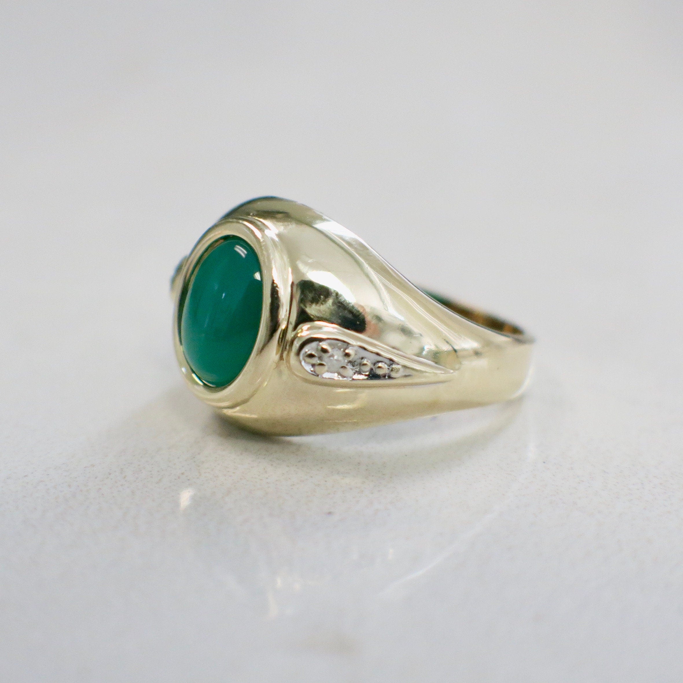 14K yellow gold Chrysoprase cabochon ring with diamond accents, size 6, featuring a polished green gemstone and delicate gold band
