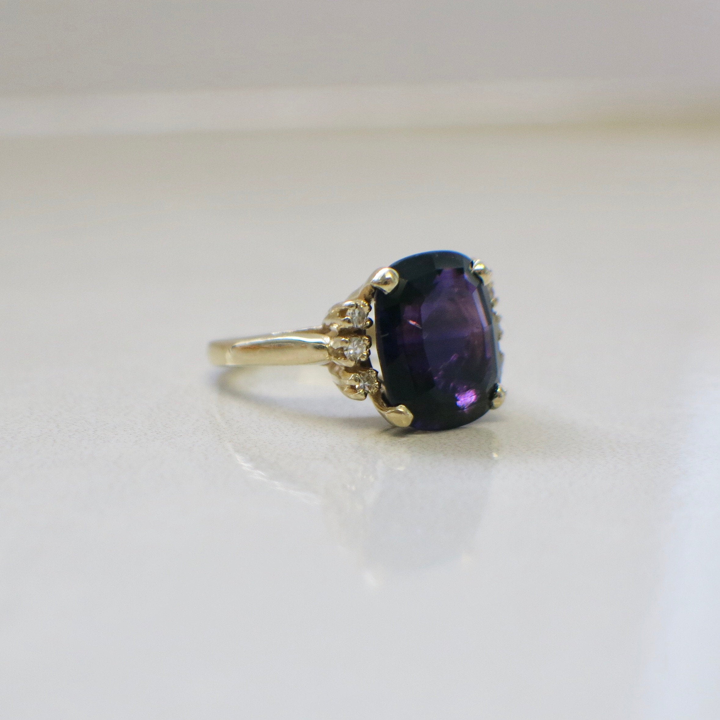 14K yellow gold cushion cut amethyst and diamond cocktail ring, size 5.25, showcasing vibrant gemstone and sparkling accents.