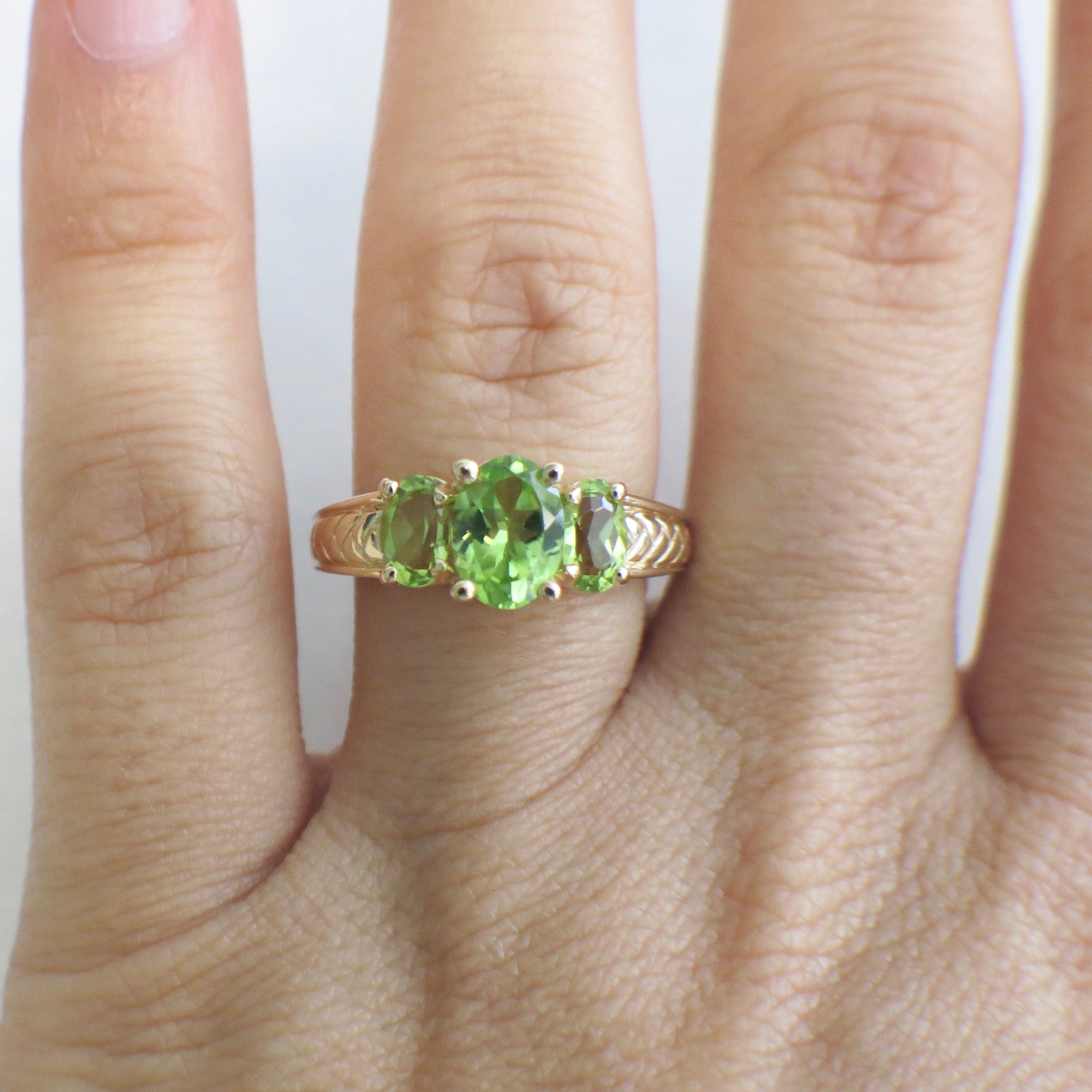 14K yellow gold Peridot three-stone ring with oval-cut stones, August birthstone, size 7, by Black Market LLC.