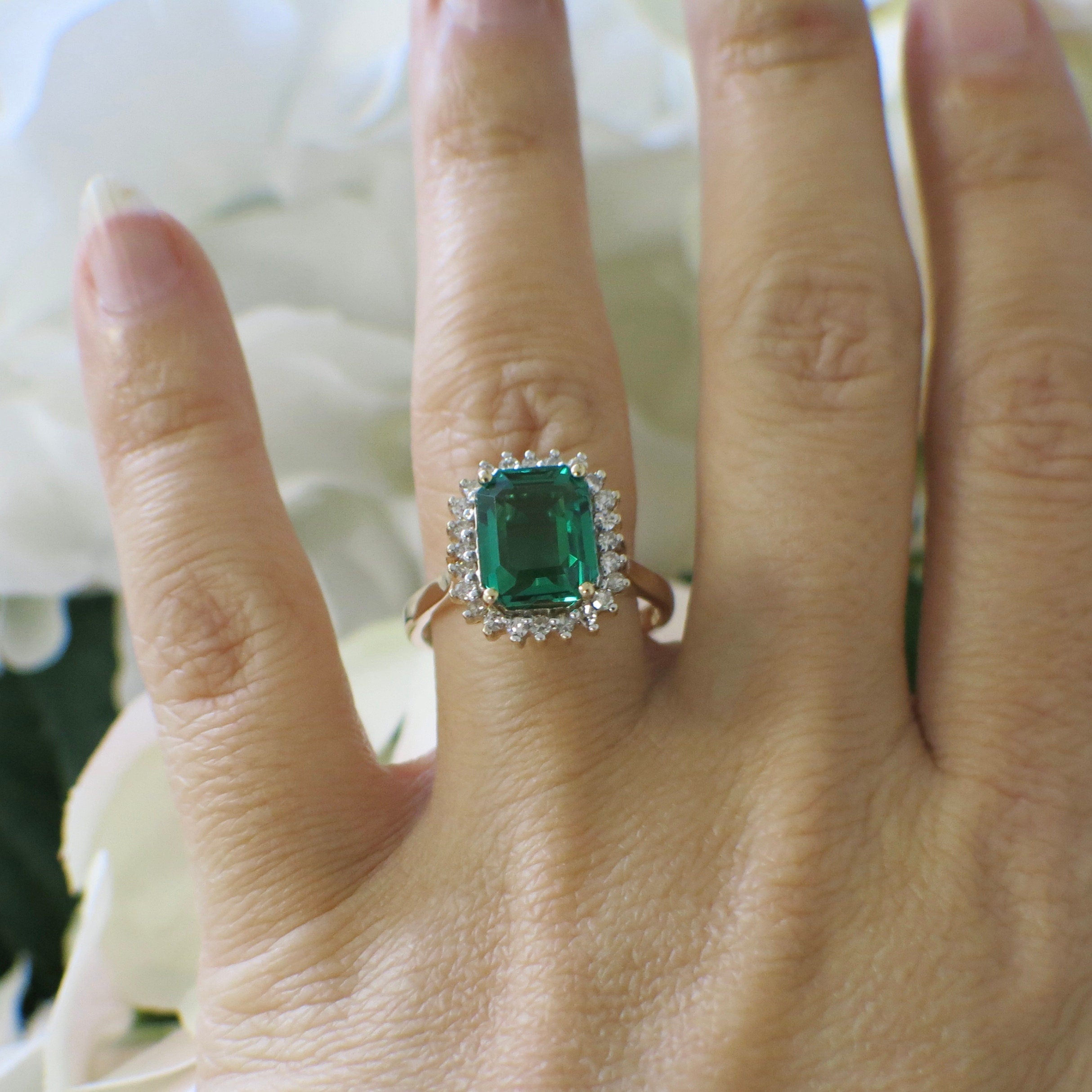 14K yellow gold vintage-inspired synthetic emerald and diamond halo ring, size 8.5, with intricate design details.