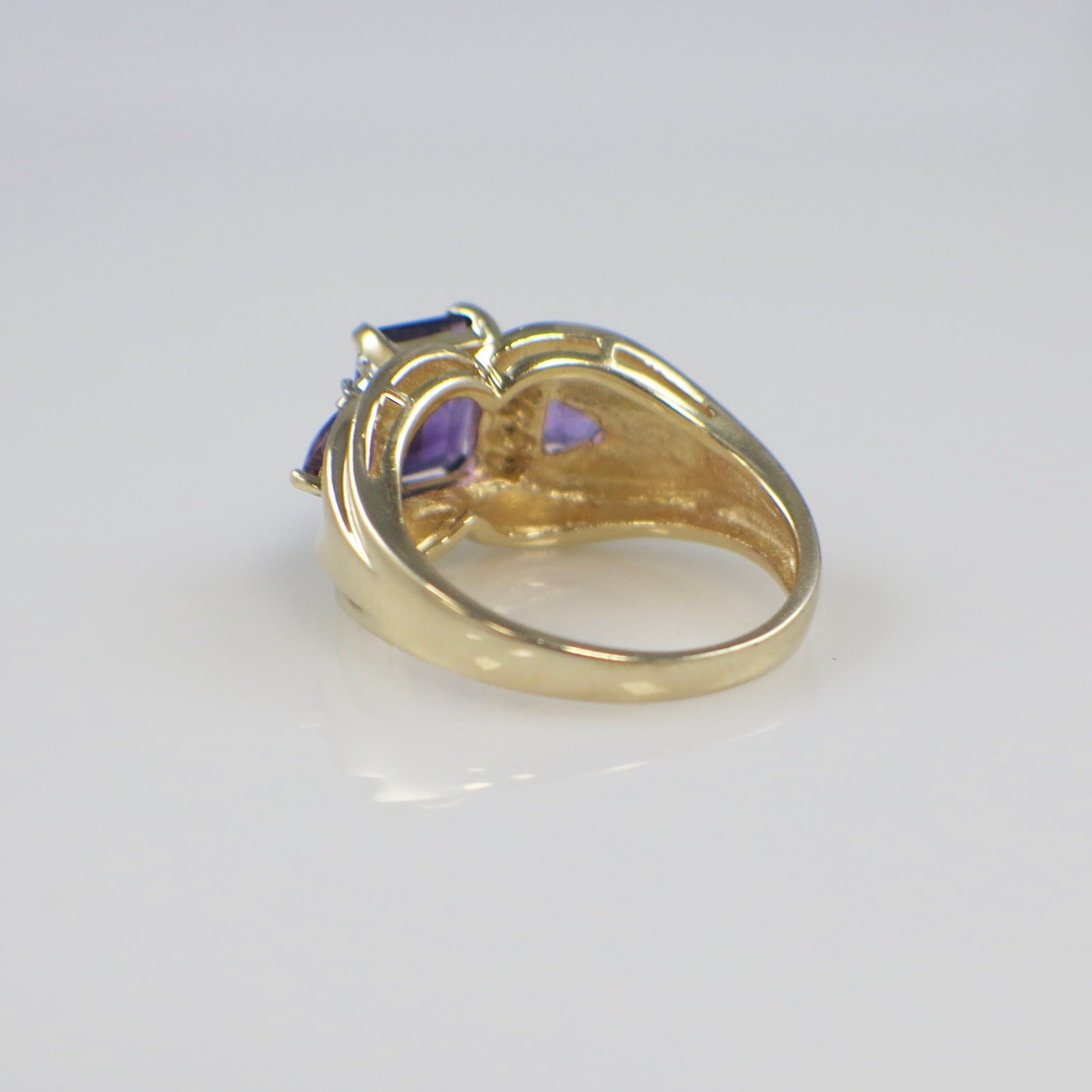 14K yellow gold Town and Country ring featuring an emerald-cut amethyst center stone with diamond side stones, size 8.5.
