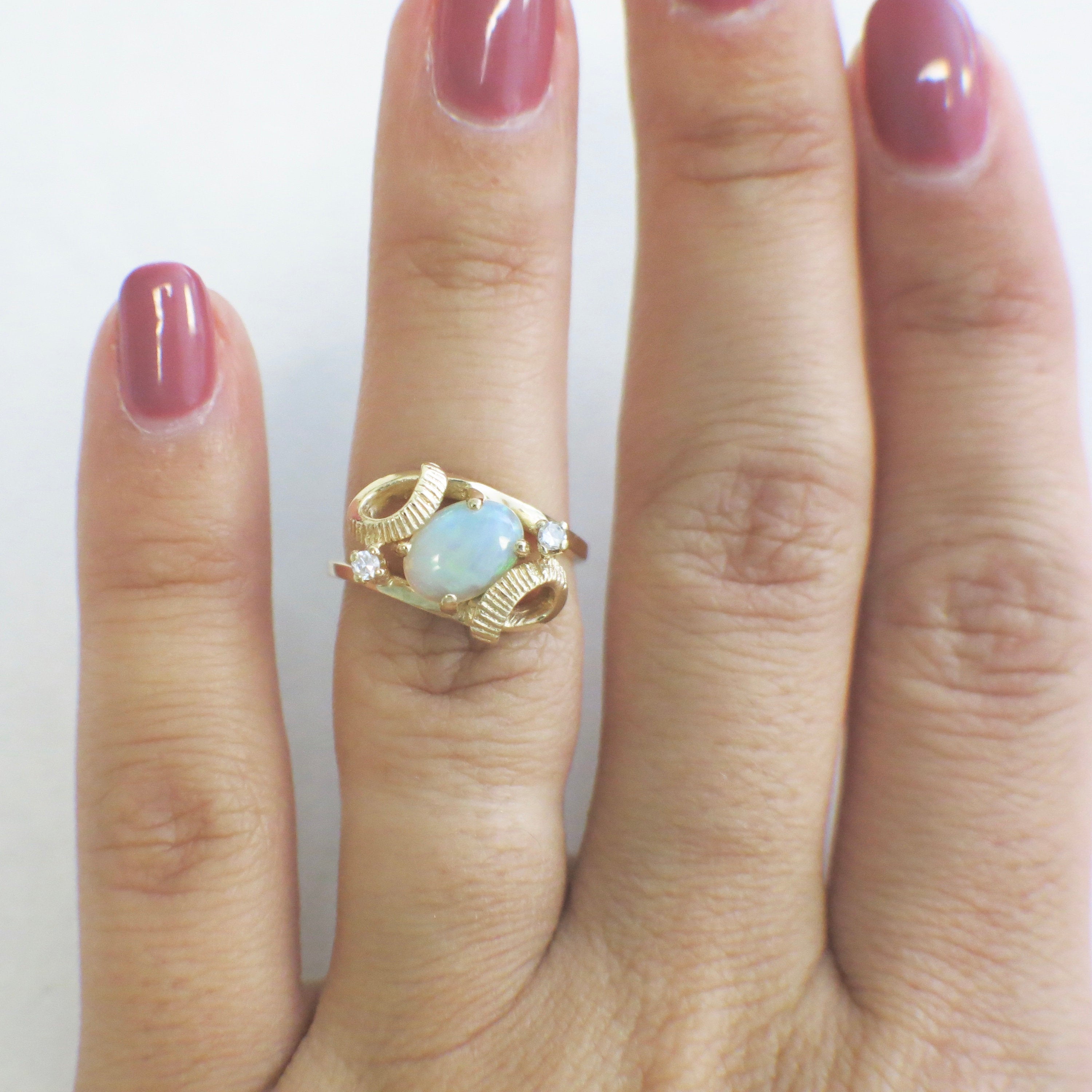 Vintage 14K yellow gold white opal and diamond ring with oval opal and European shank, size 4, by Black Market LLC.