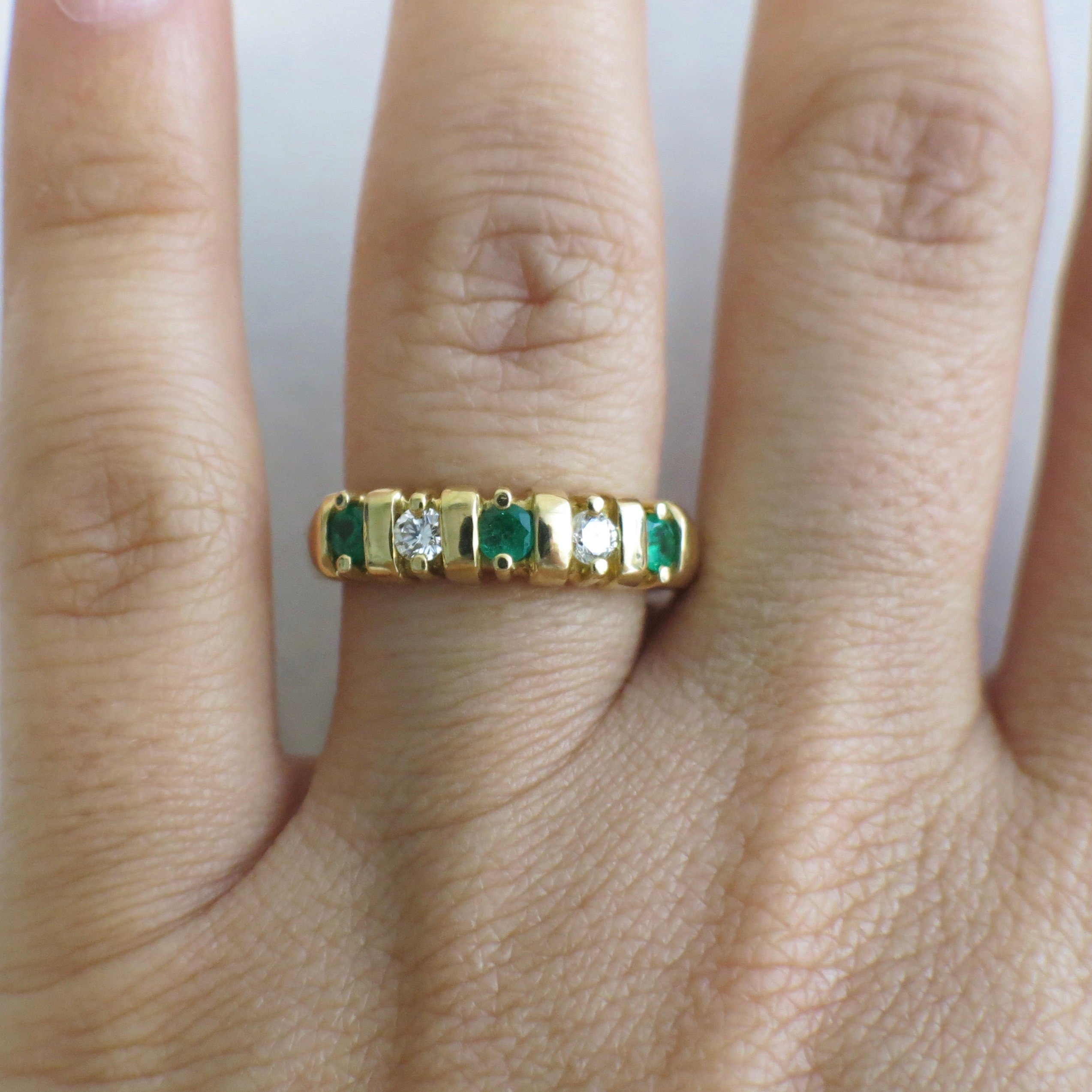 Vintage 18K yellow gold emerald and diamond band ring with five stones, size 7, from Black Market LLC.