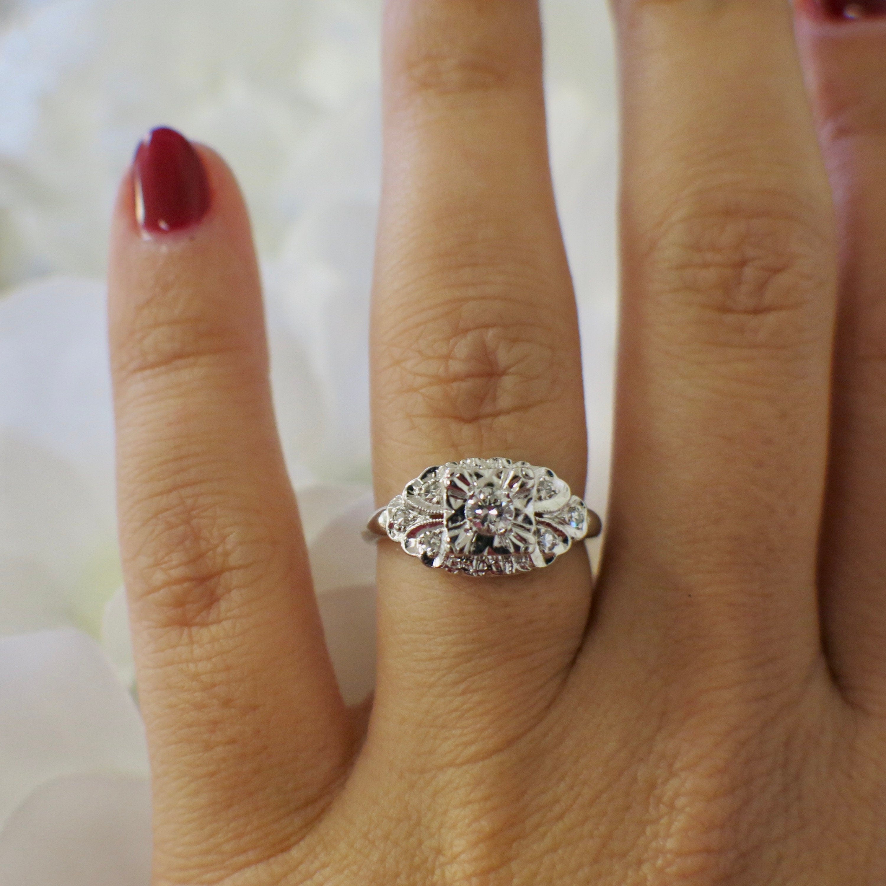 Vintage 14K white gold diamond engagement ring with milgrain detailing, size 5.75, from Black Market LLC.