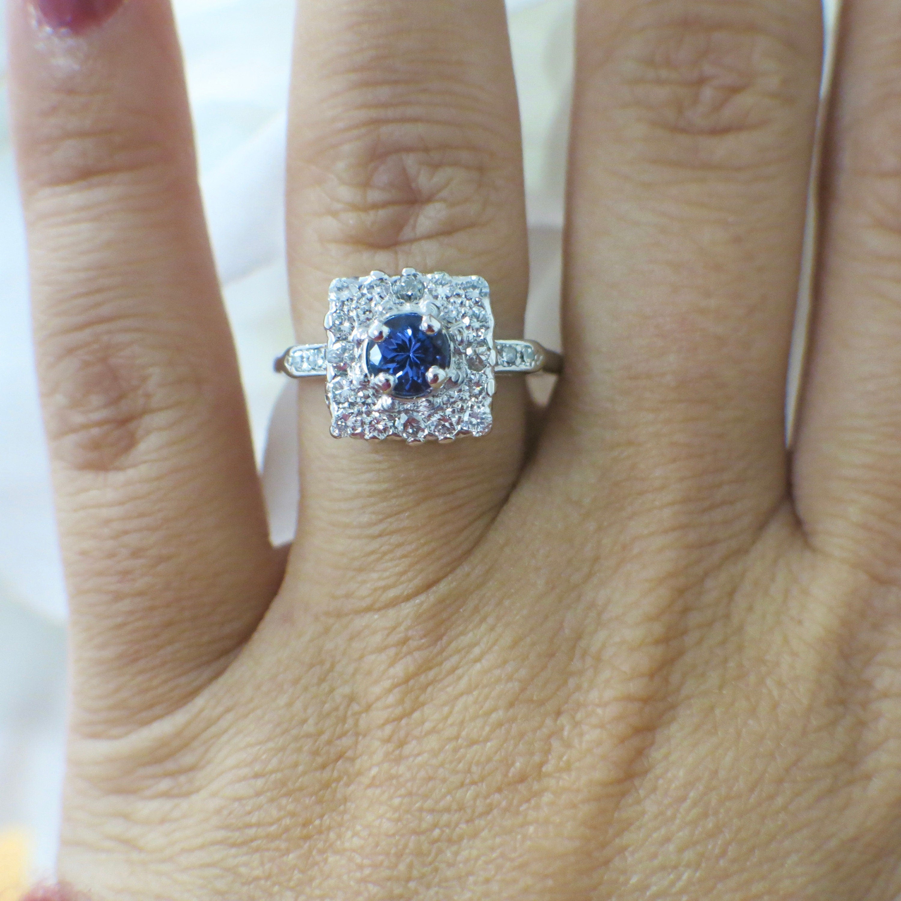 Vintage platinum tanzanite and diamond halo ring with square cluster design, .56 CTW diamonds, size 6.75, by Black Market LLC.