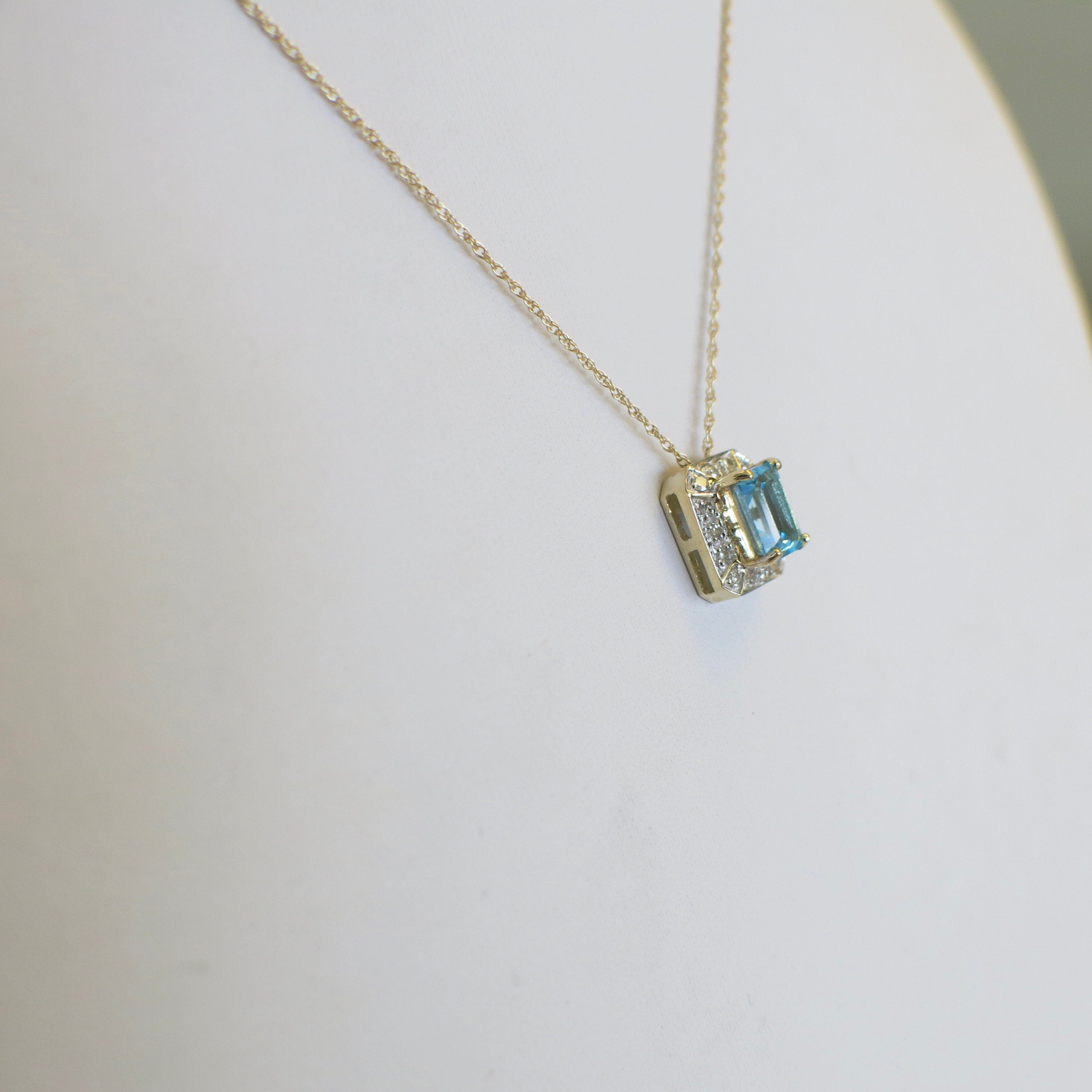 10K Gold Swiss Blue Topaz Necklace with Diamond Halo – 18" Pendant - Black Market LLC