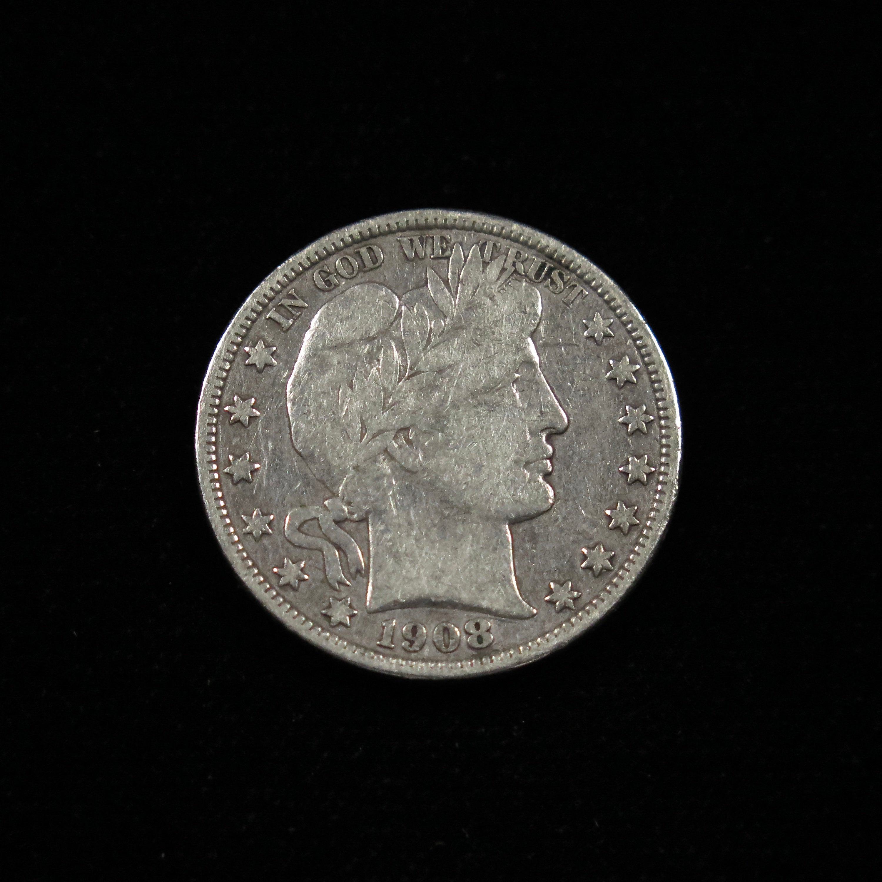 1908-O Barber Half Dollar U.S. silver coin, fine condition, raw, from New Orleans Mint, classic design, produced by Black Market LLC.